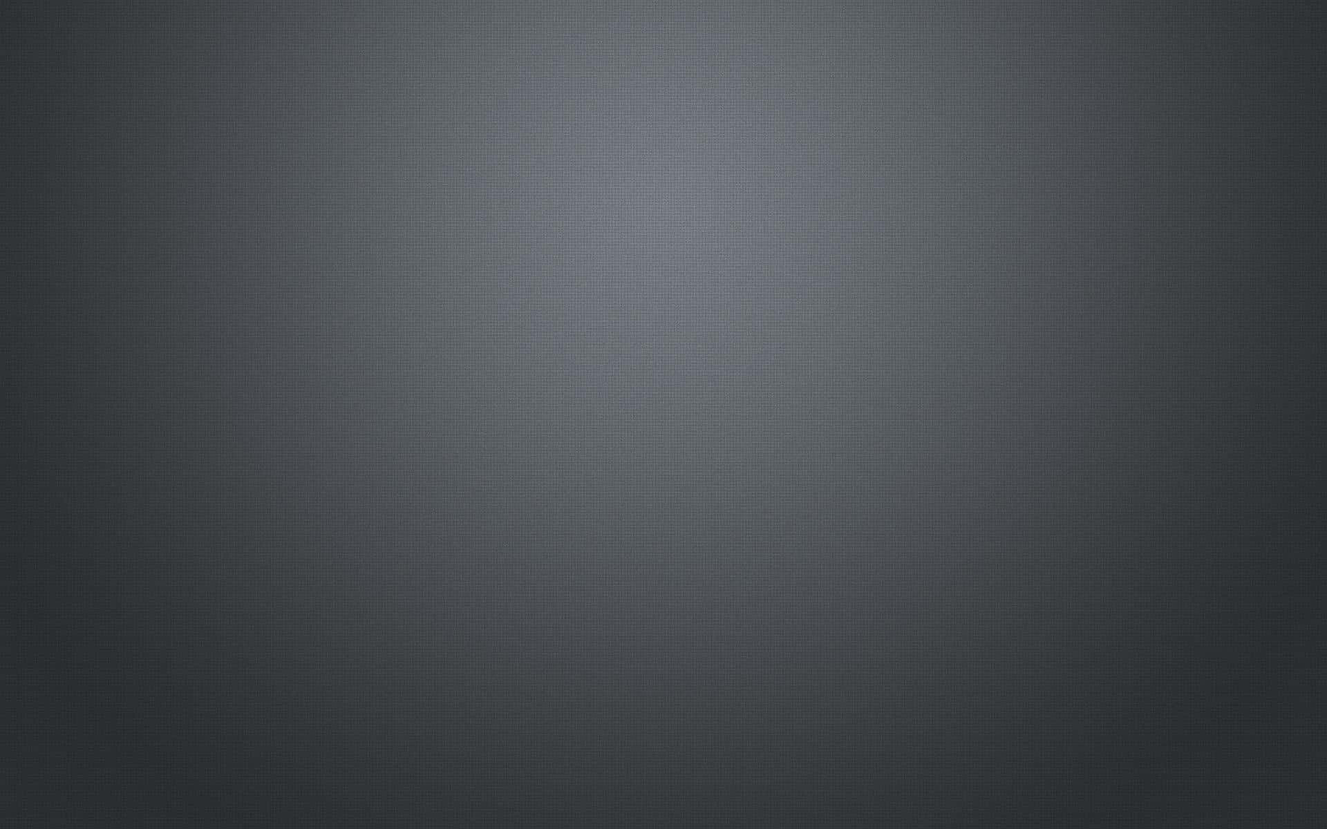 灰色 桌布 壁紙 — 極簡漸變灰色背景，帶有從深色中心漸變到淺色中心的細微圓點圖案。