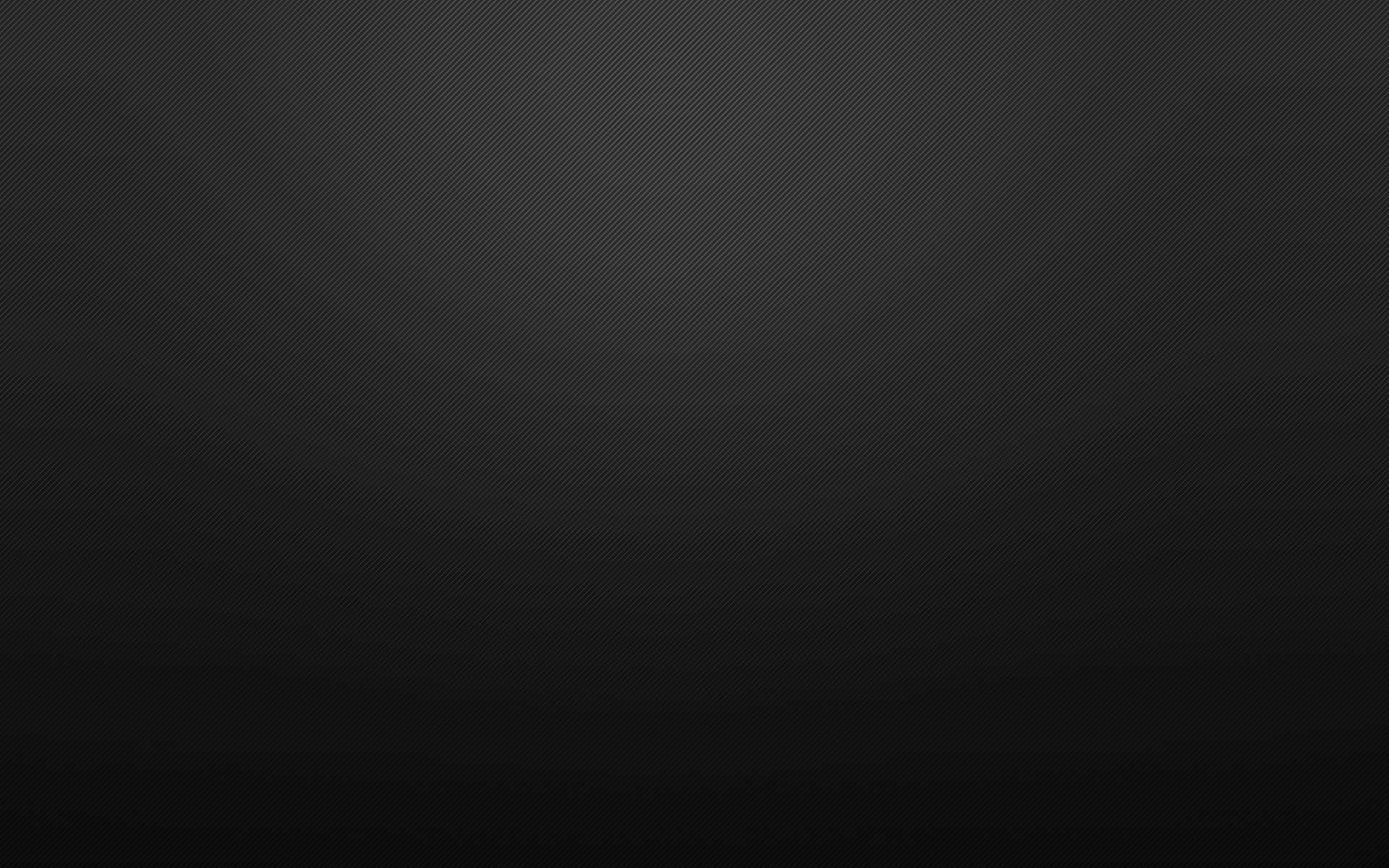 Plain Black Desktop 桌布 壁紙 — 極簡漸變背景，帶有從深灰色到近乎黑色的微妙對角紋理。