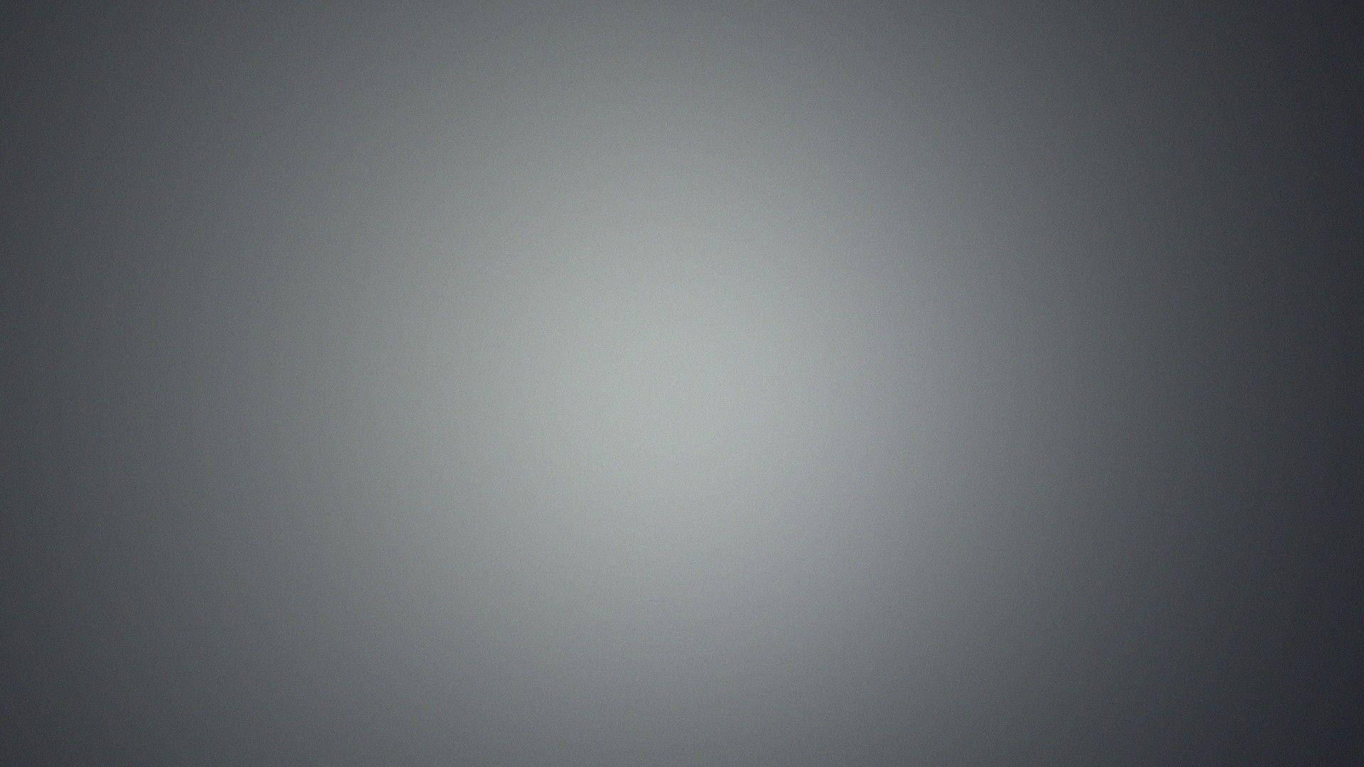 Gradient 桌布 壁紙 — 極簡漸變背景，從淺灰色中心過渡到較深灰色邊緣。