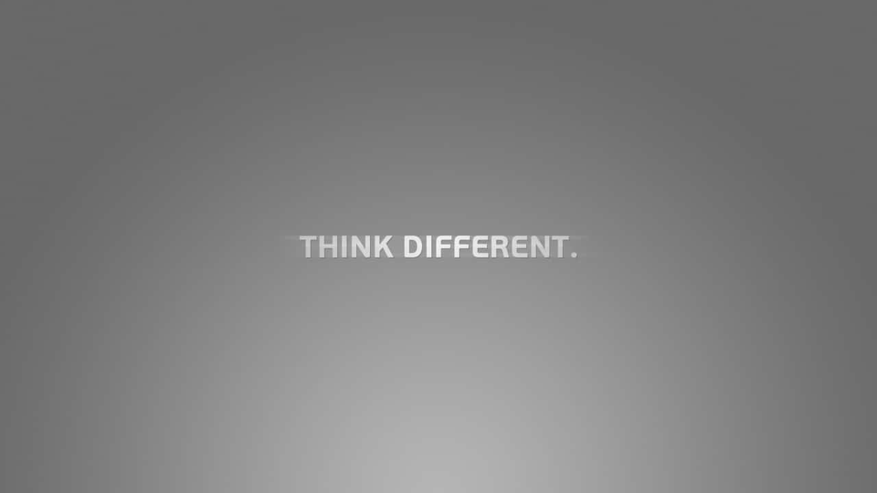 Disparate 桌布 壁紙 — 極簡灰色漸變背景，中央白色文字寫著 think different。