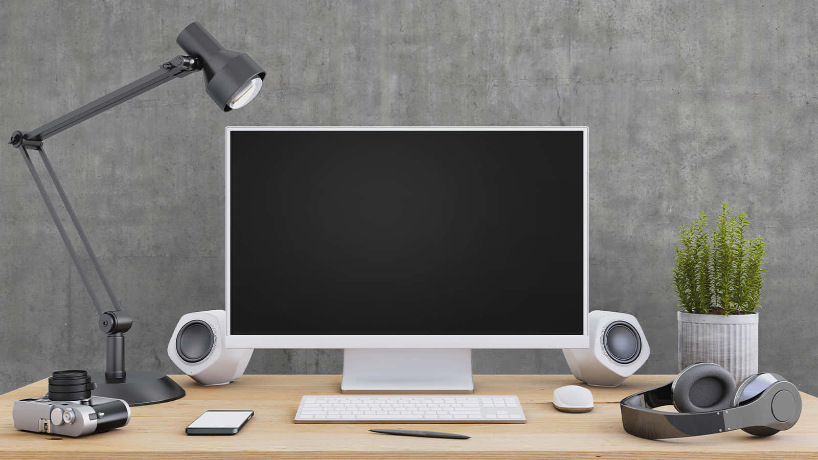 Best Desktop 桌布 壁紙 — 極簡現代辦公桌設置，配有顯示器燈、相機和耳機，背景為紋理灰色牆壁。