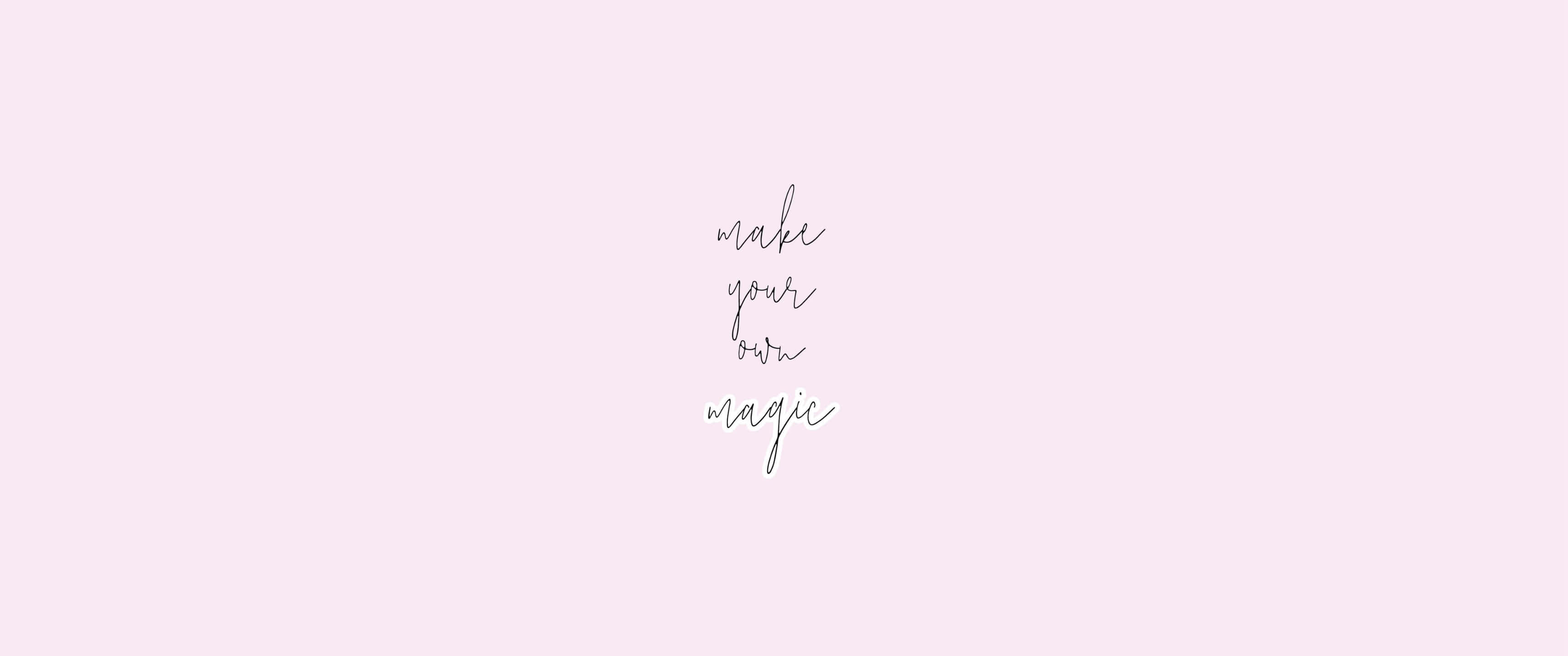 Pink Cute 桌布 壁紙 — 極簡粉紅色背景，帶有精緻草書文字寫著 make your own magic。