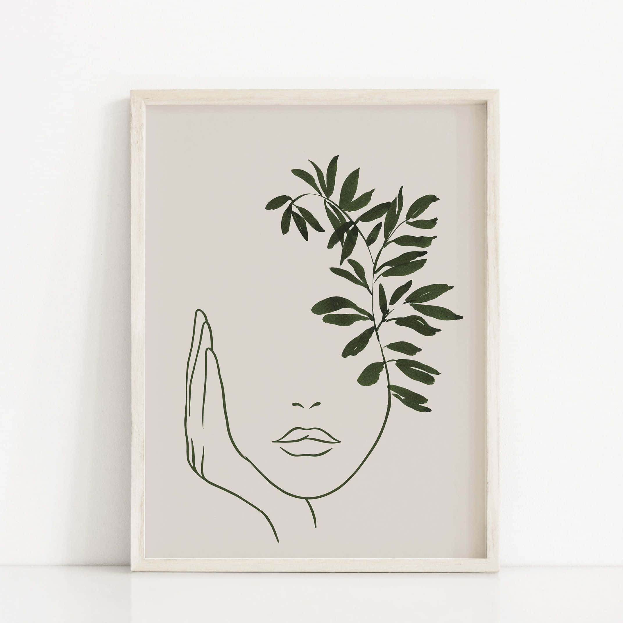 Modern Minimalist Art 桌布 壁紙 — 極簡線條藝術，一張臉被帶葉的樹枝遮住一隻眼睛，白色畫框掛在素牆上。
