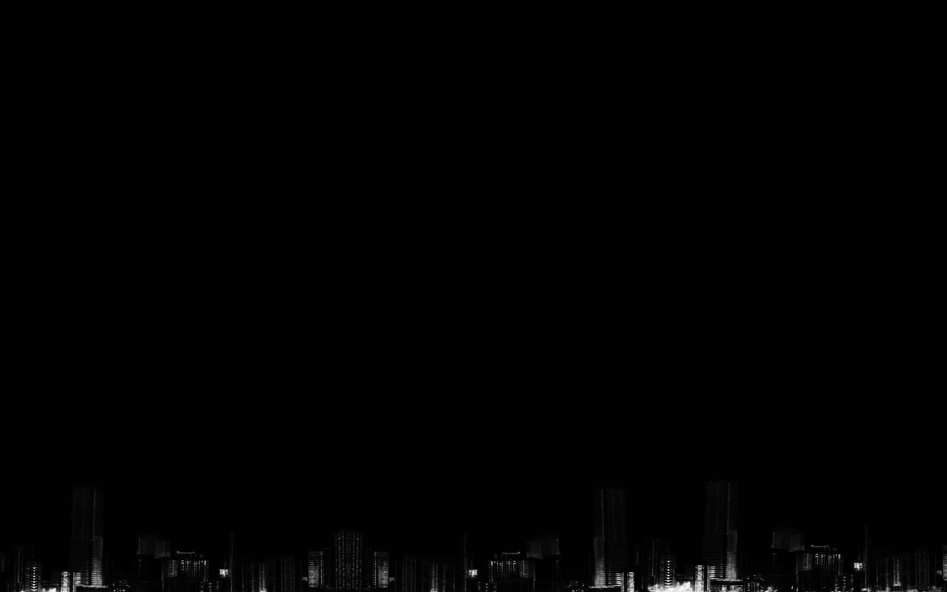 Black Macbook 桌布 壁紙 — 極簡黑白城市天際線夜景，窗戶在黑暗天空中發光。