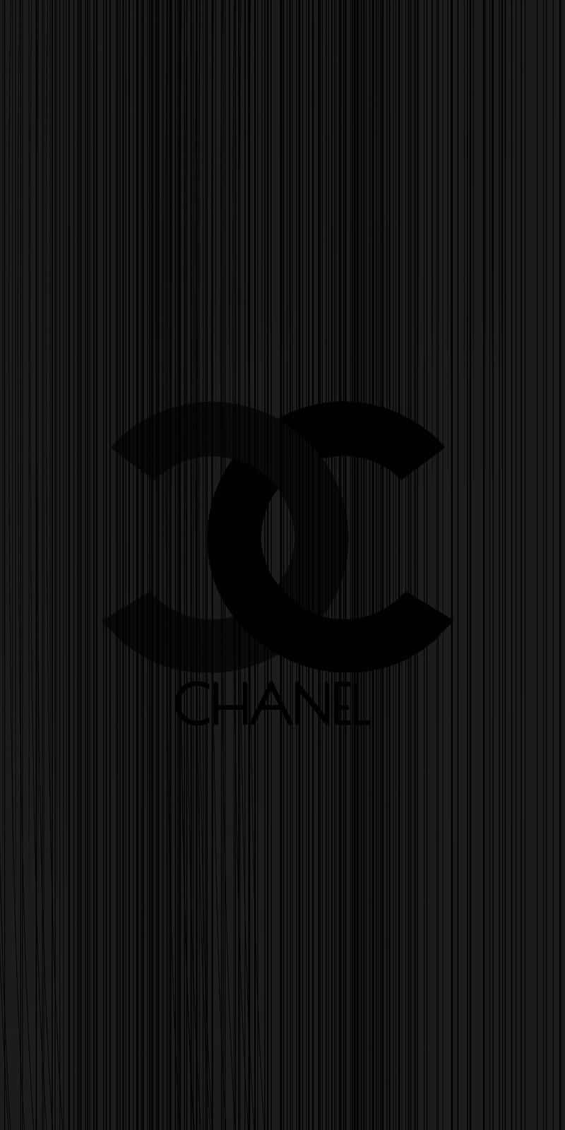 藝術 桌布 壁紙 — 極簡黑色桌布，中央帶有標誌性的 Chanel 標誌，背景為微妙的垂直條紋紋理。