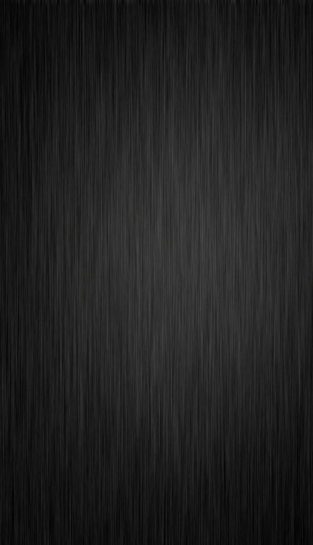 Black And Gray 桌布 壁紙 — 極簡黑色桌布，帶有微妙的垂直拉絲金屬紋理漸變。