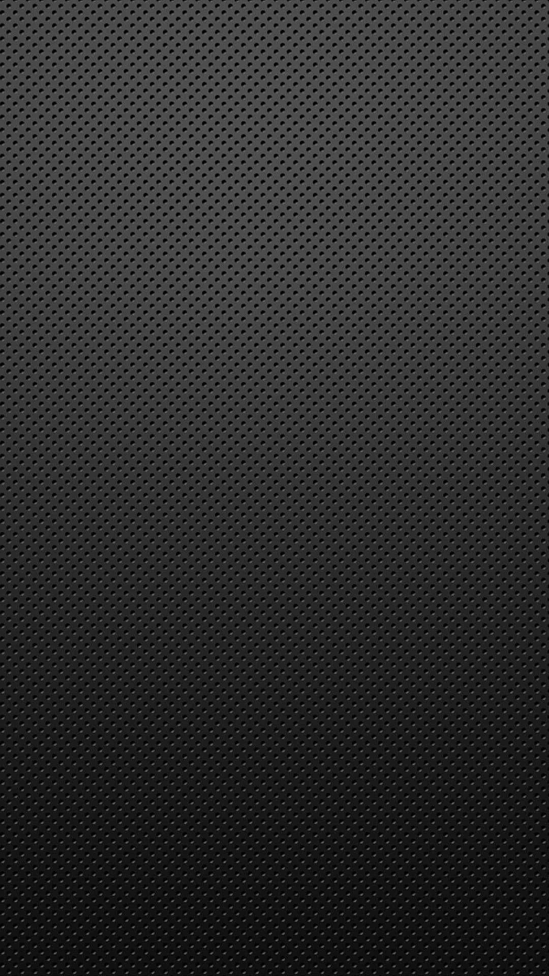 Carbon Fiber iPhone 桌布 壁紙 — 極簡黑色桌布，帶有微妙的點陣紋理，垂直漸變為較暗色調。