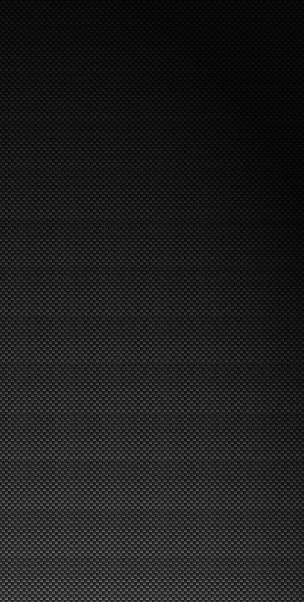 Carbon Fiber iPhone 桌布 壁紙 — 極簡黑色碳纖維紋理壁紙，帶有微妙的漸變照明。