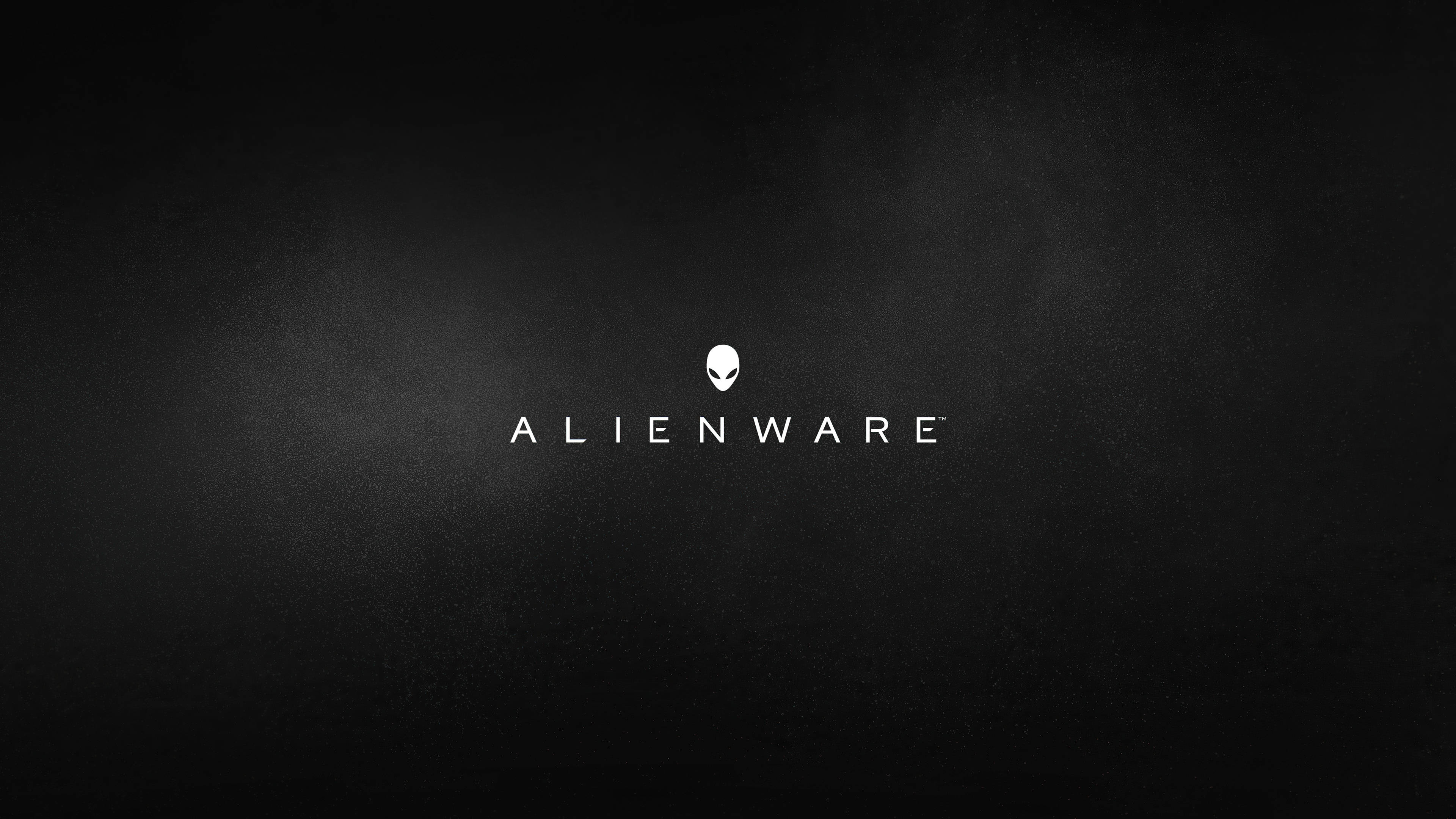 white alienware 桌布 壁紙 — 極簡黑色紋理背景，白色Alienware標誌居中，帶有柔和光暈。