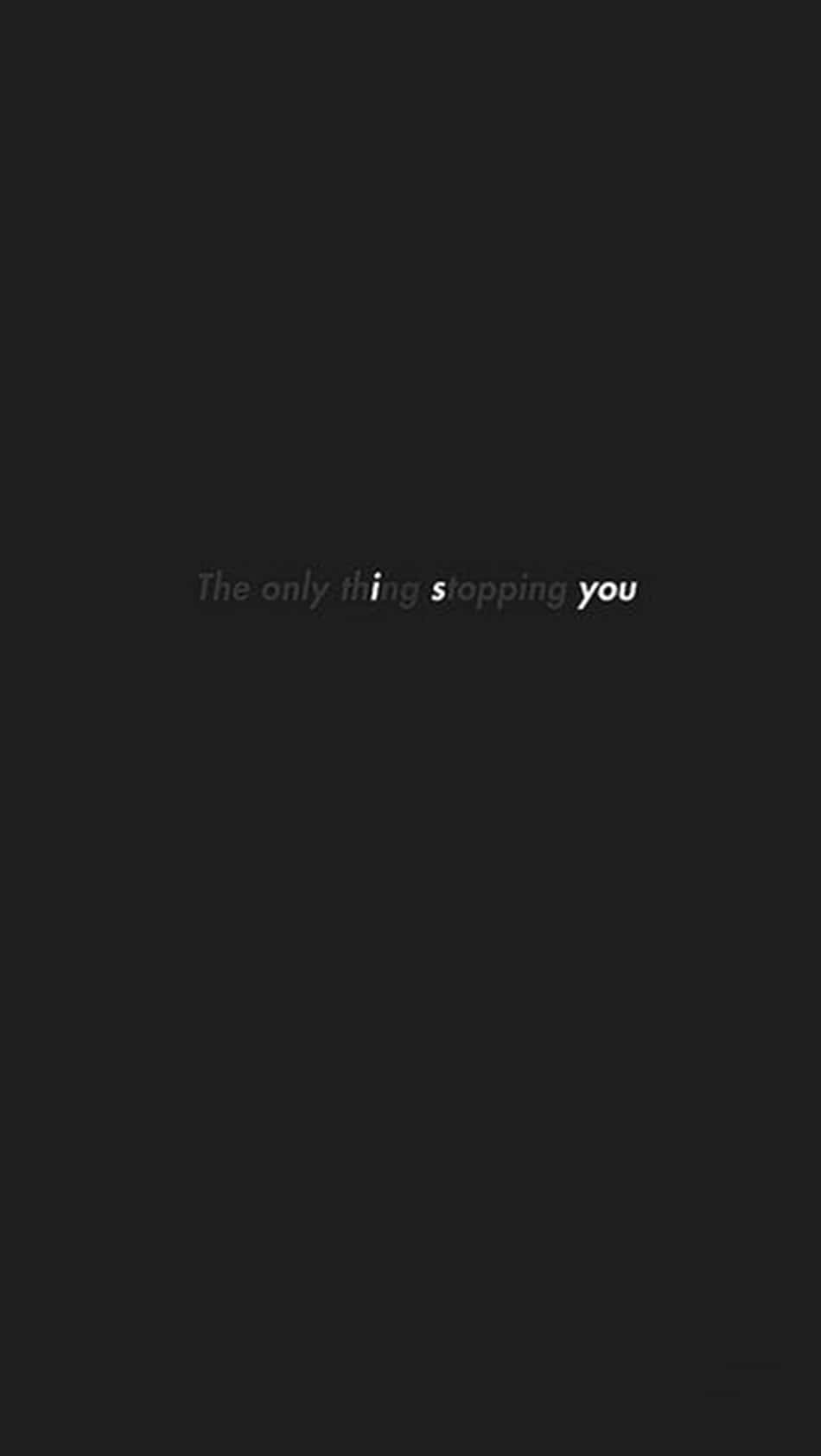 桌布 壁紙 — 極簡黑色背景，中央放置勵志文字「The only thing stopping you」，採用柔和灰色和白色。