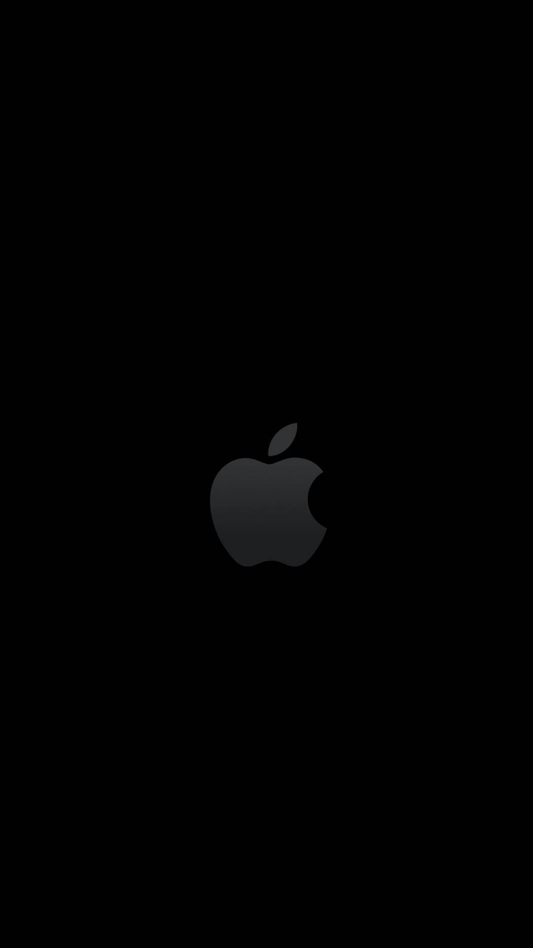 黑色 桌布 壁紙 — 極簡黑色背景，中央有一個微妙的灰色 Apple 標誌。