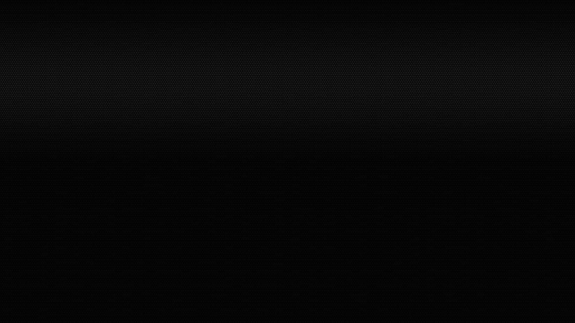 Black Solid 桌布 壁紙 — 極簡黑色背景，帶有微妙漸變和細點紋理。