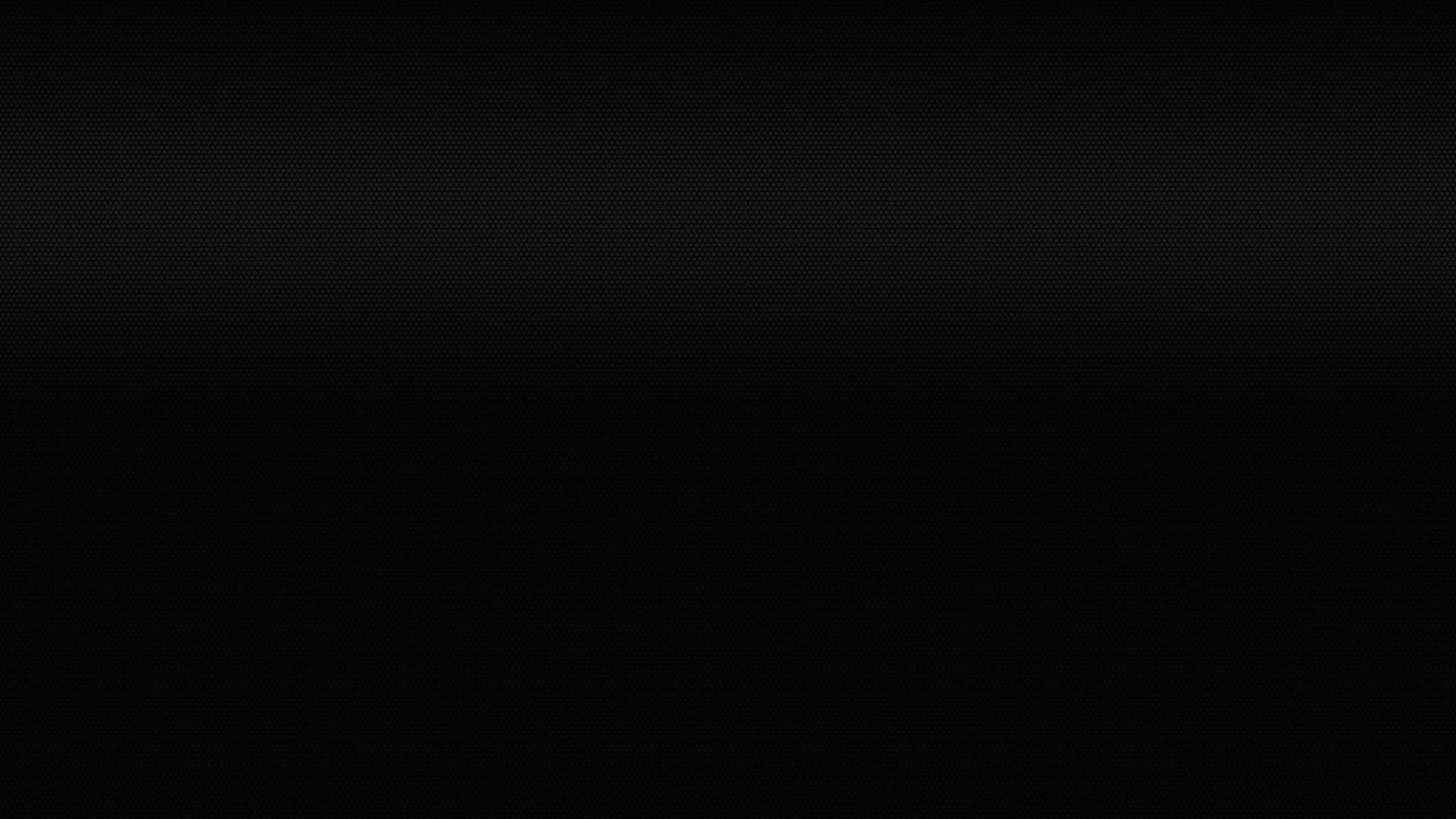 Plain Black Desktop 桌布 壁紙 — 極簡黑色背景，帶有微妙的漸變和細點紋理。