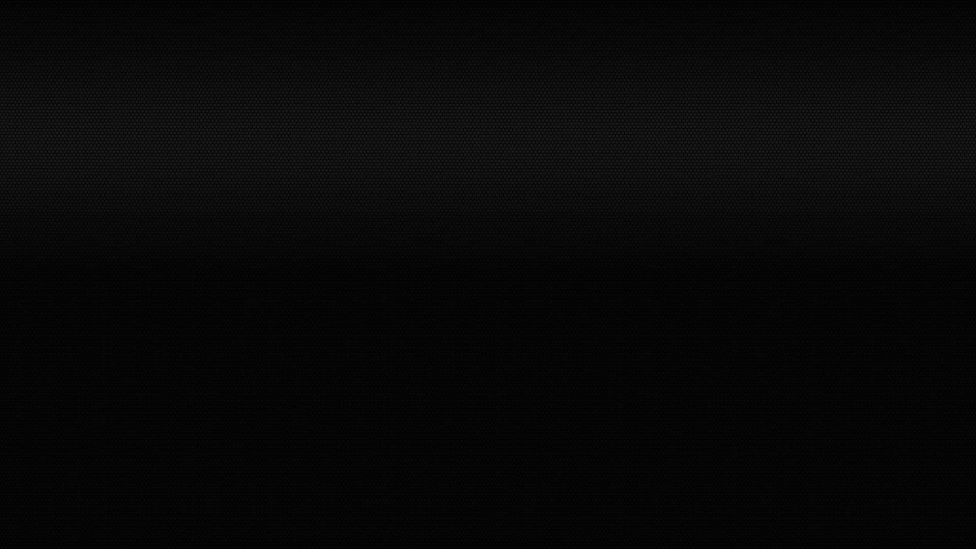 black textured 桌布 壁紙 — 極簡黑色背景，帶有細微漸變和精細點狀紋理。