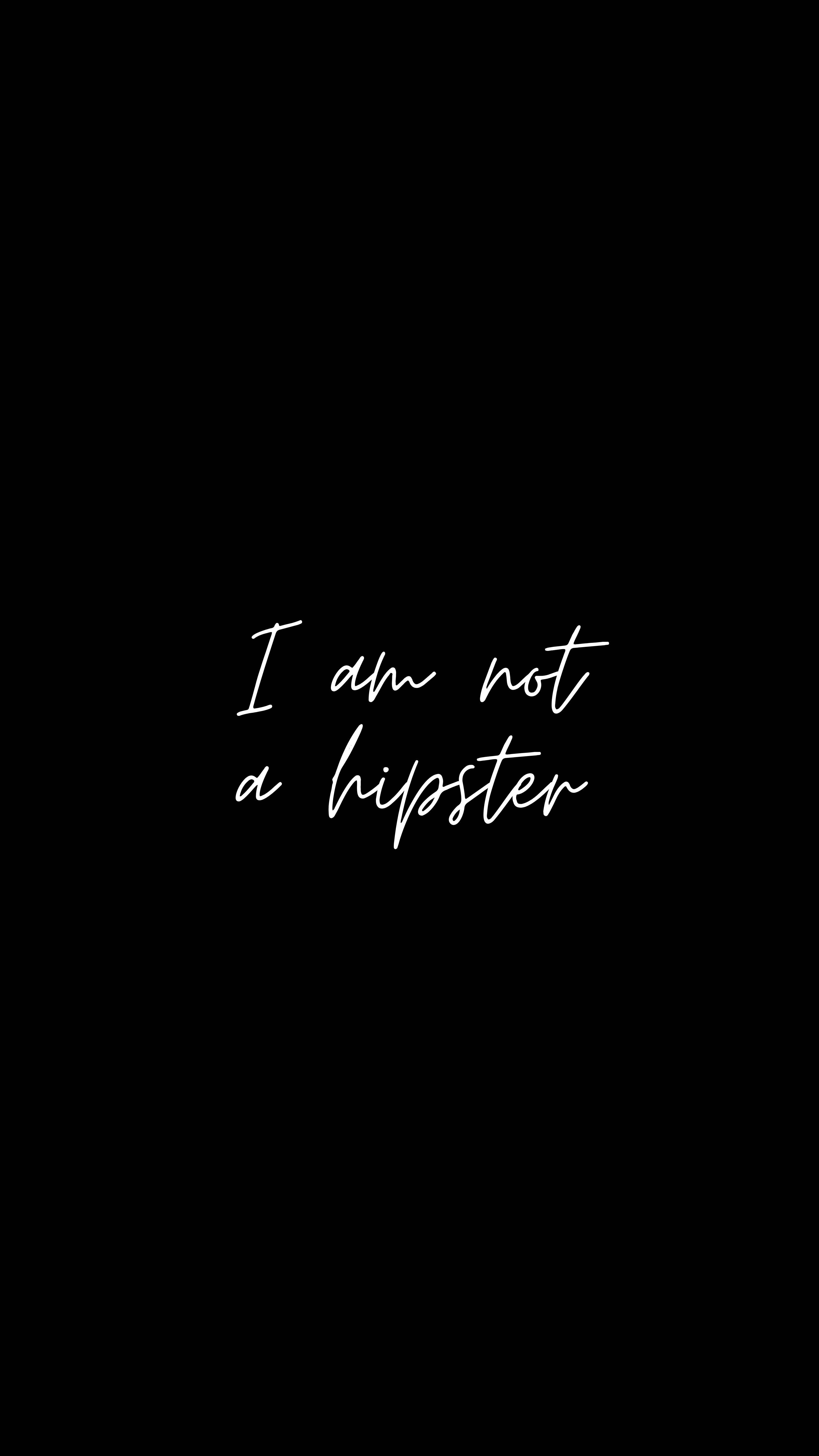 Hipster 桌布 壁紙 — 極簡黑色背景，白色草書文字居中宣告「I am not a hipster」。