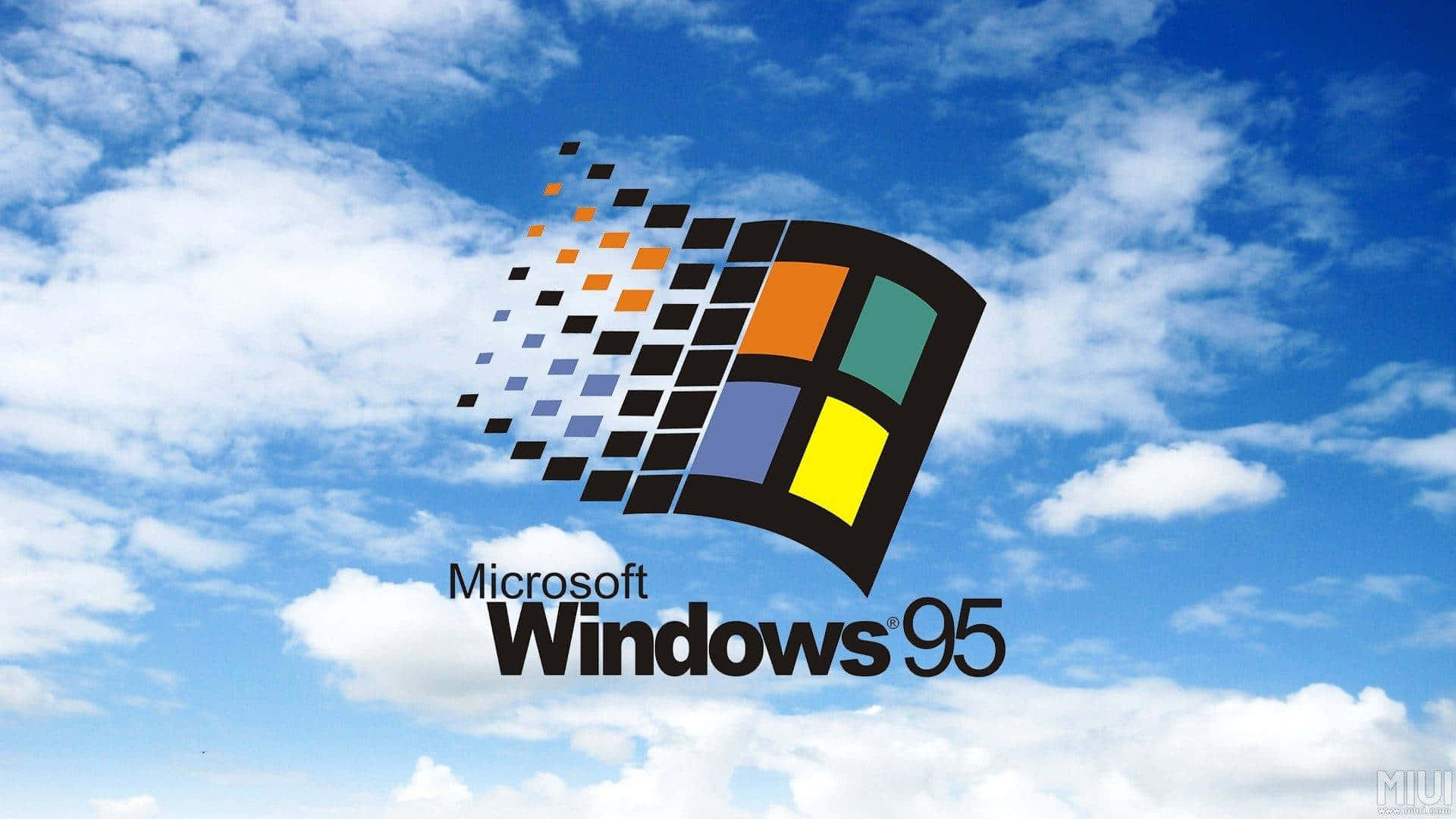 Windows 95 動態圖 桌布 壁紙 — 標誌性的 Windows 95 標誌，帶有色彩繽紛的四格視窗和像素化軌跡，漂浮在明亮的藍天和白雲之上。