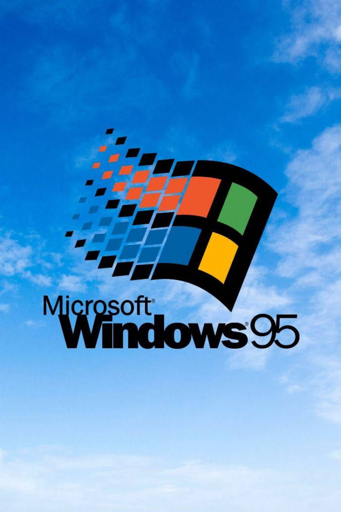 手機 桌布 壁紙 — 標誌性的 Windows 95 標誌，帶有色彩繽紛的像素化窗口設計，漂浮在明亮的藍天和白雲之間。
