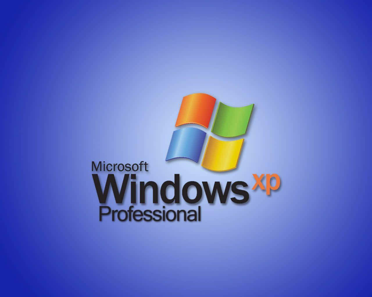  壁紙 — 標誌性的 Windows XP Professional 標誌，中央是色彩繽紛的四窗格視窗標誌，背景為漸變藍色。