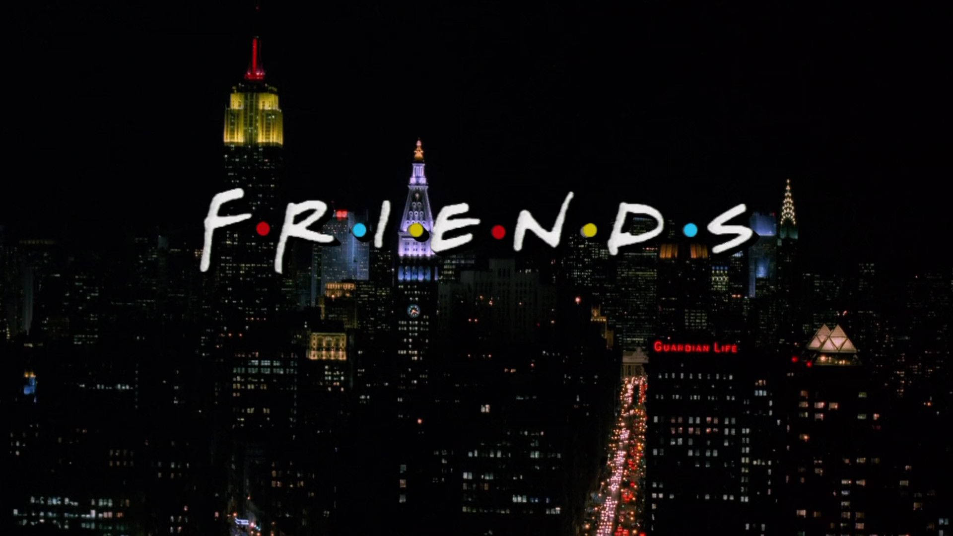 Friends 桌布 壁紙 — 標誌性的《六人行》標誌在充滿活力的夜間紐約市天際線上閃耀，照亮了摩天大樓和繁華的街道。