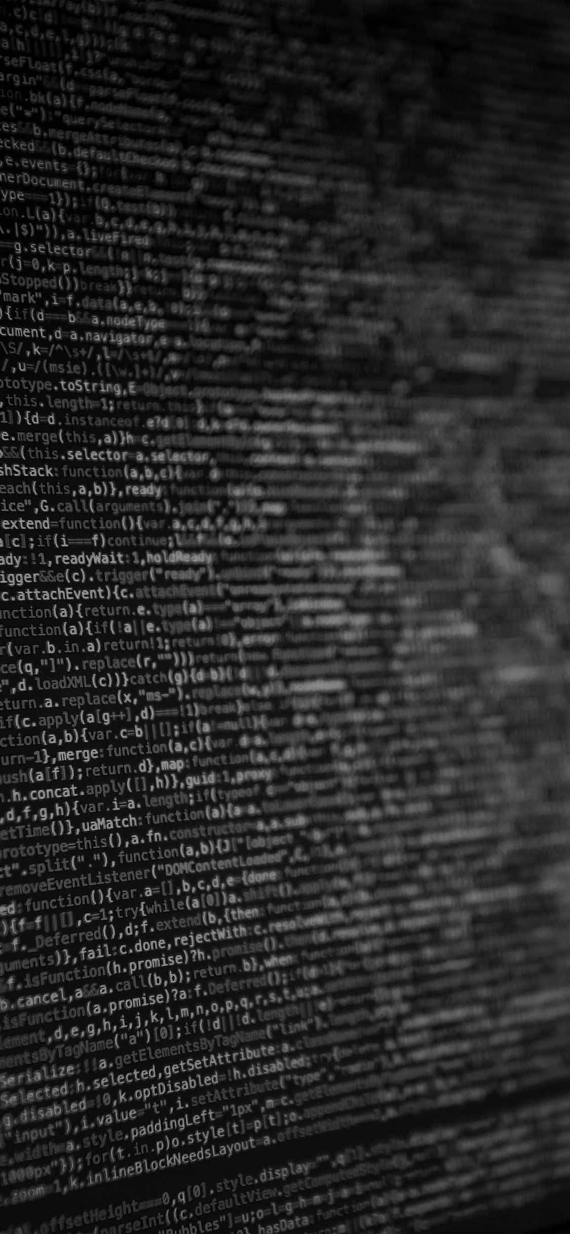 Code 桌布 壁紙 — 模糊的電腦代碼行在單色調中柔和發光的特寫。