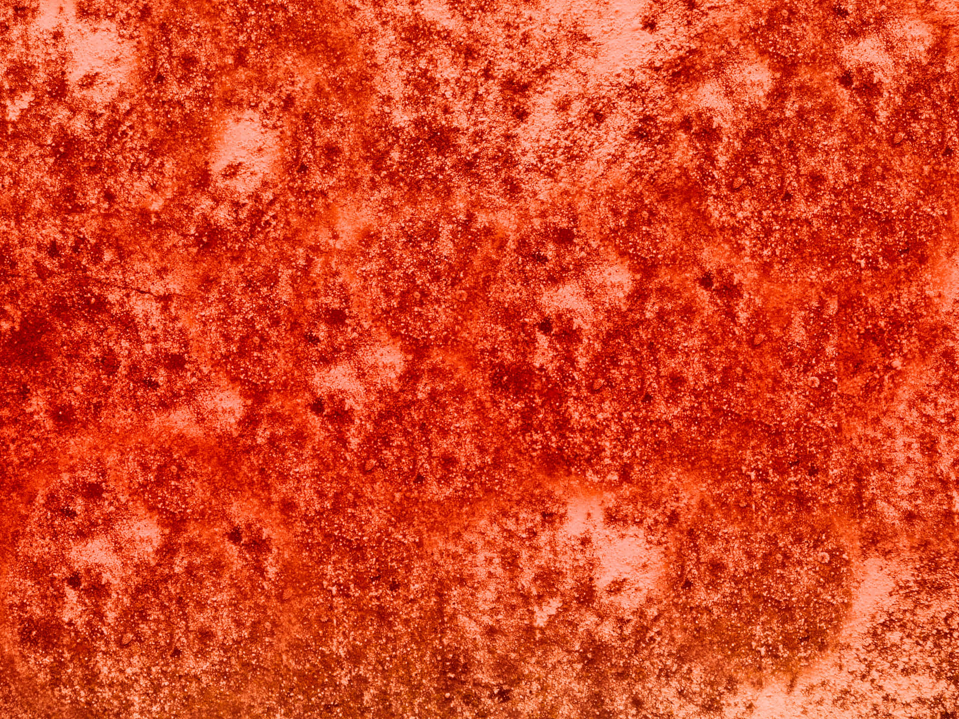 Red stone texture 壁紙 — 橙色風化表面的特寫，帶有斑點狀鏽跡和褪色斑塊，露出較淺的底色。
