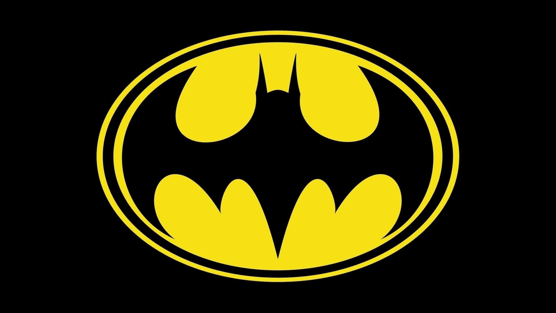 Batmobile Desktop 桌布 壁紙 — 橢圓框內大膽的黃色蝙蝠標誌，在純黑色背景上顯得格外突出。