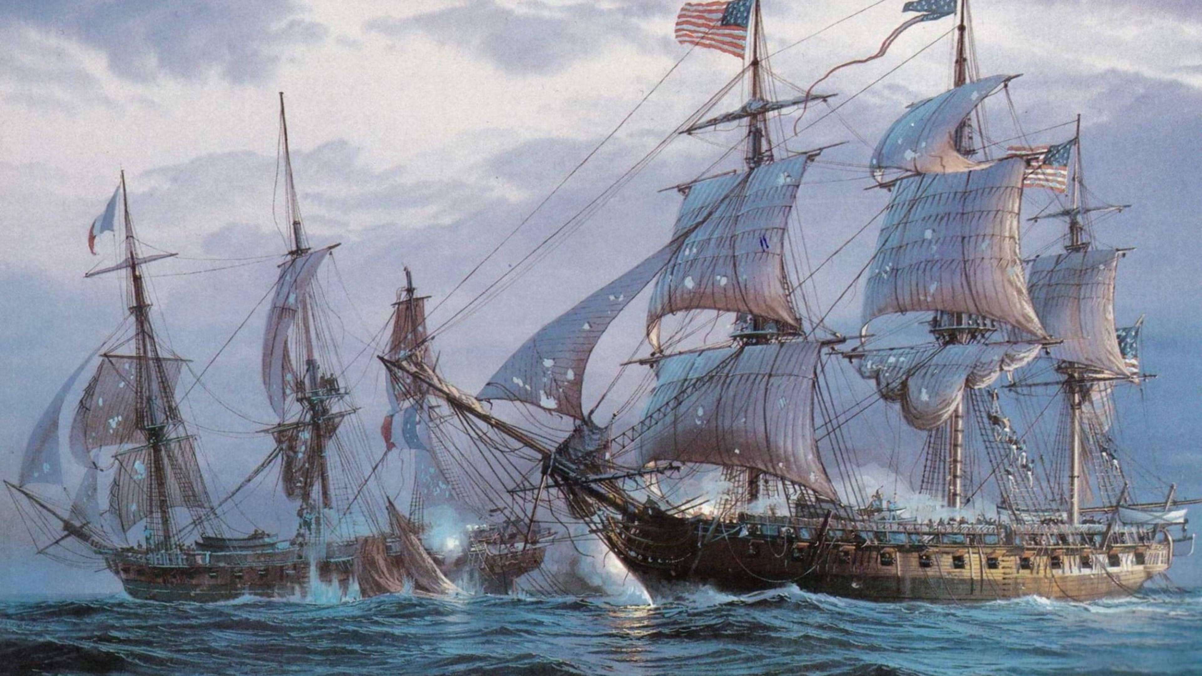 Sailing Ship 桌布 壁紙 — 歷史性的海戰，美國和法國船隻在暴風雨的海面上，多雲的天空下發射大砲。