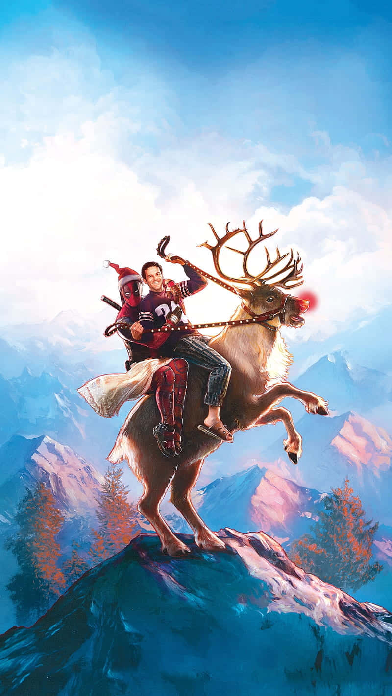 桌布 壁紙 — 死侍和一個男人騎著馴鹿在白雪覆蓋的山頂上，背景是明亮的藍天和遠山。