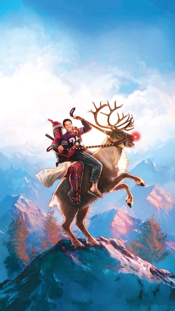 Marvel Christmas 桌布 壁紙 — 死侍和一個男人騎著馴鹿在白雪覆蓋的山頂上，天空湛藍，雲朵蓬鬆。