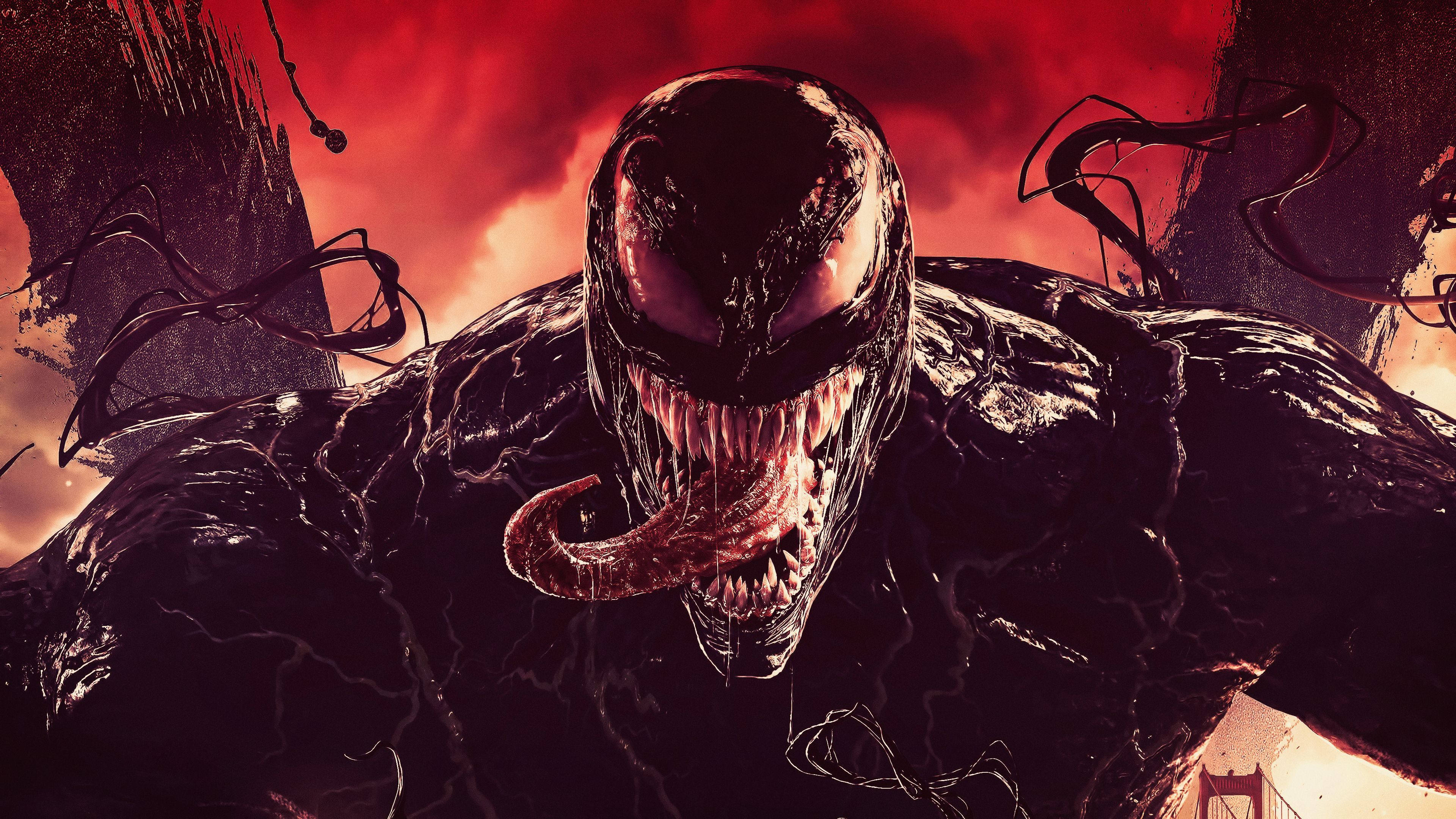 Venom Carnage 桌布 壁紙 — 毒液在火紅的天空下以威脅姿態出現，觸手纏繞著他怪誕的身軀。