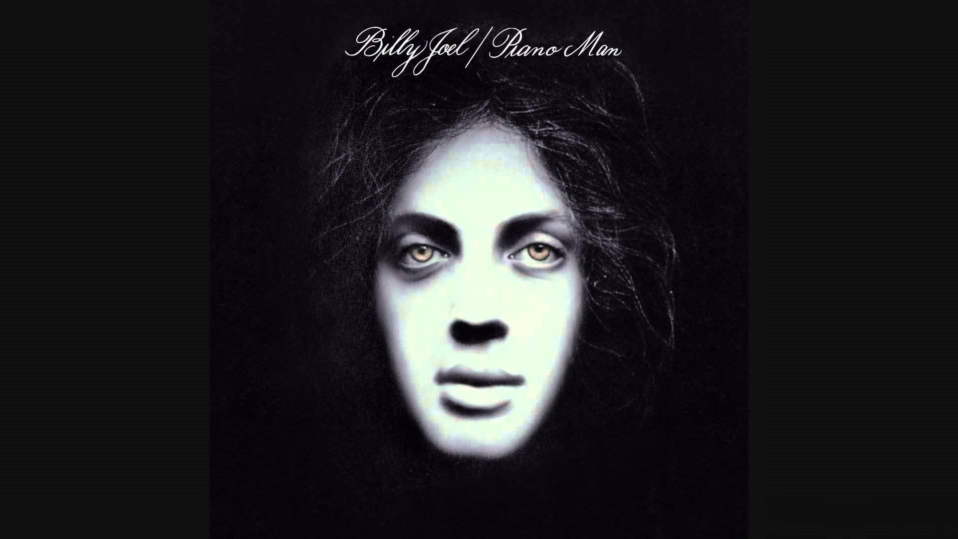 鋼琴 桌布 壁紙 — 比利·喬爾（Billy Joel）的《Piano Man》專輯封面中，一張在純黑背景下、眼睛發光的詭異燈光肖像。