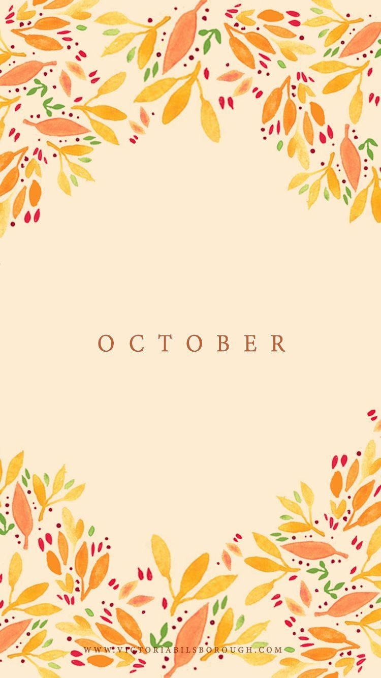 October 桌布 壁紙 — 水彩秋葉以溫暖的橙色、黃色和綠色圍繞著奶油色背景，中間是「十月」一詞。