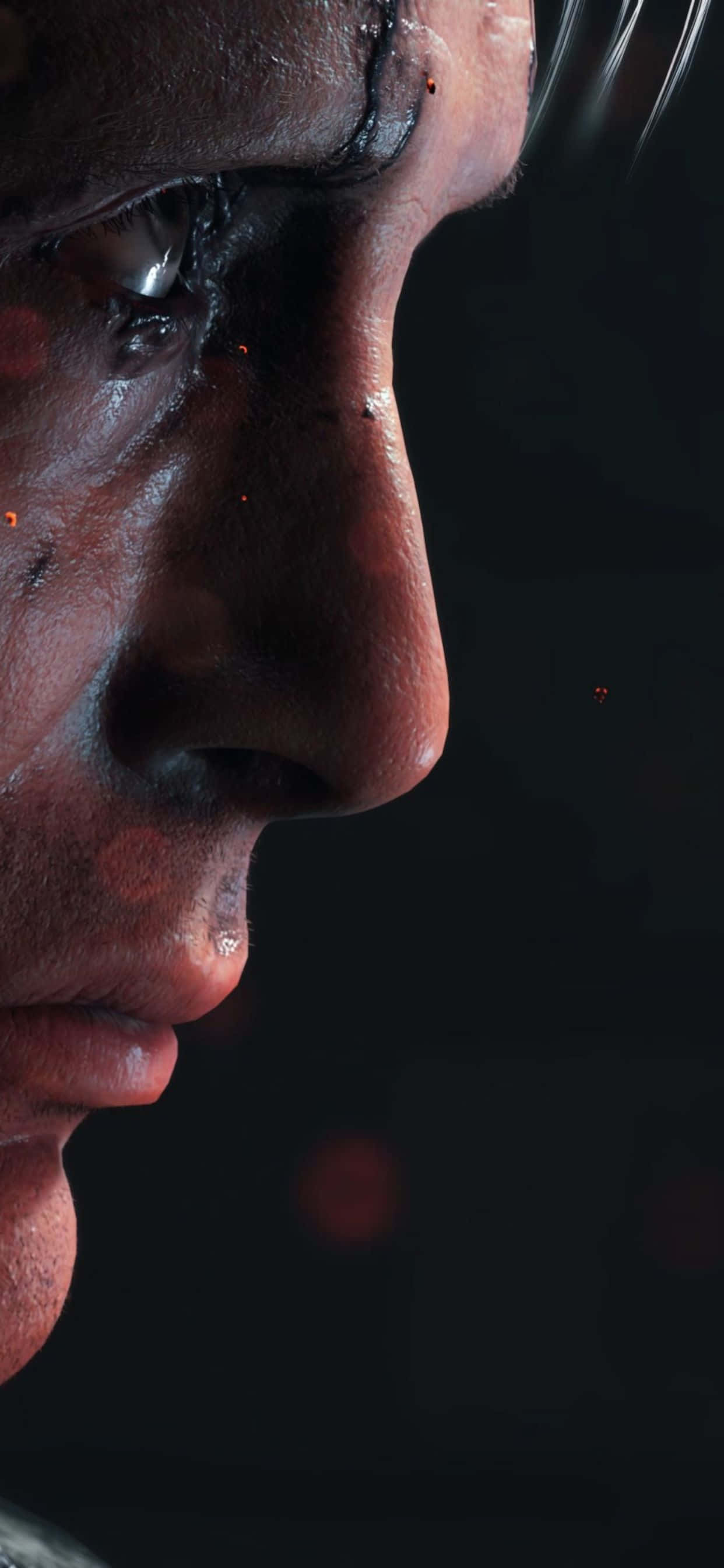 iPhone Xs Max Death Stranding 桌布 壁紙 — 汗流浹背的男子側面特寫，背景黑暗，帶有發光的紅色散景燈光。