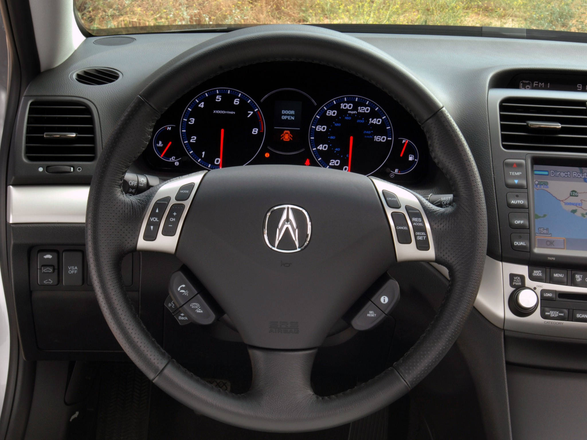 Acura 桌布 壁紙 — 汽車內部儀表板及方向盤的特寫視圖，配有發光儀表及導航螢幕。