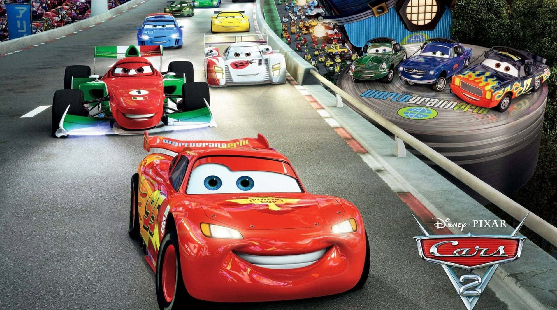 Lightning Mcqueen 桌布 壁紙 — 《汽車總動員2》中充滿活力的動畫賽車場景，閃電麥坤帶領一群色彩繽紛的擬人化賽車在蜿蜒的賽道上奔馳。