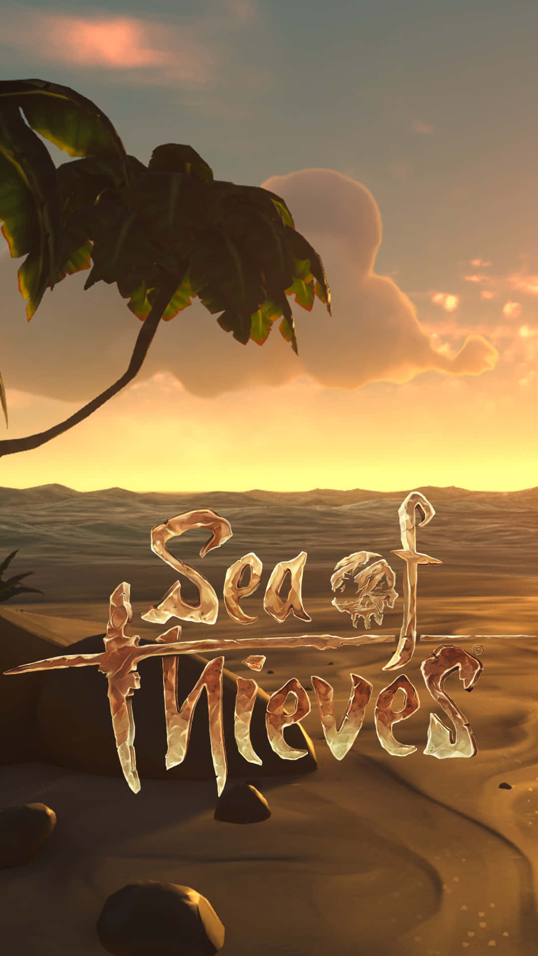 Sea Of Thieves Phone 桌布 壁紙 — 沙漠上的金色日落，棕櫚葉和遊戲標題 Sea of Thieves 在沙中發光。