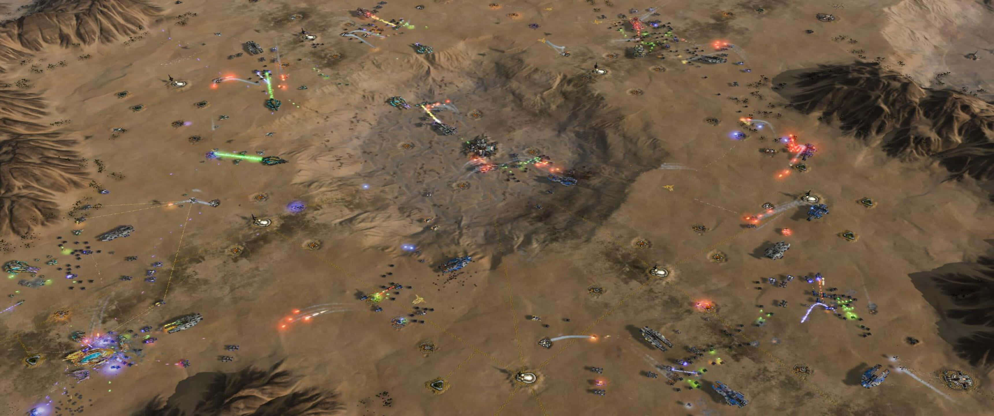 1440p Ashes Of The Singularity Escalation 桌布 壁紙 — 沙漠戰場的鳥瞰圖，發光的能量武器和爆炸照亮了乾旱的地形。
