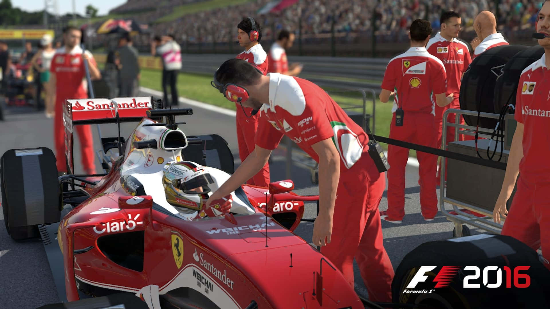 F1 2016 桌布 壁紙 — 法拉利一級方程式車隊的紅色制服維修人員在陽光明媚的比賽日照顧一輛紅色賽車。