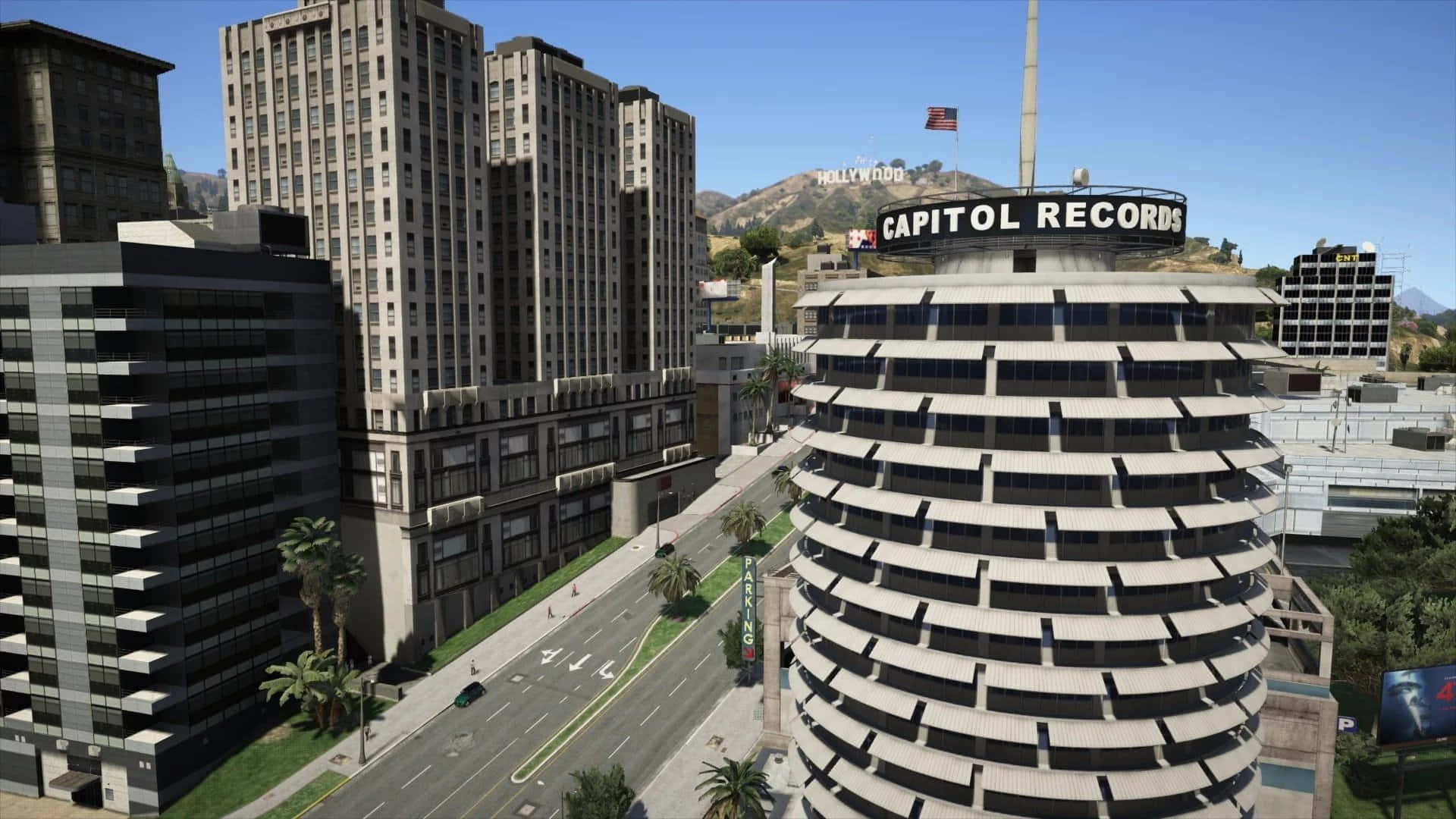 Sunny Day 桌布 壁紙 — 洛杉磯標誌性 Capitol Records 大樓的晴朗日景，遠處山丘上可見好萊塢標誌。