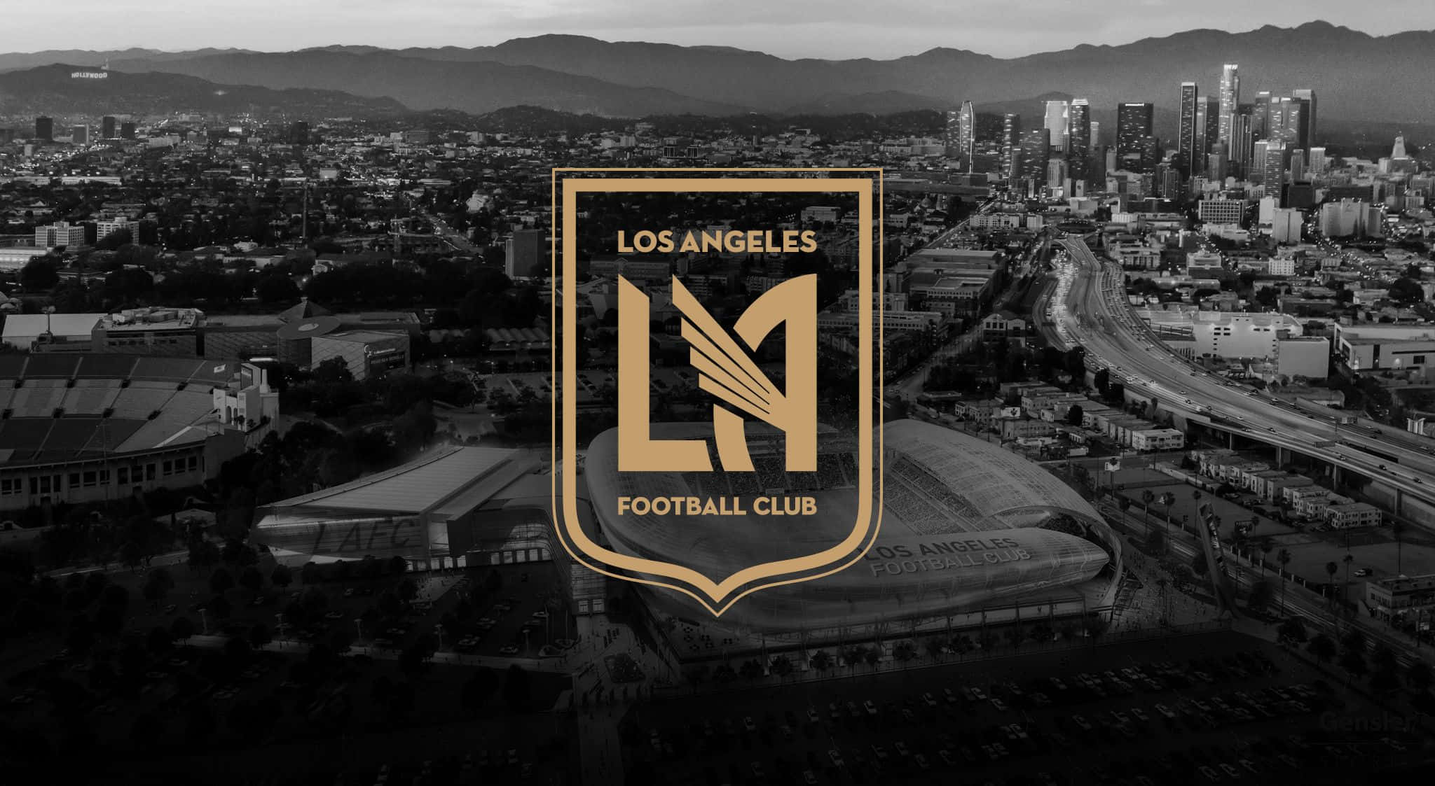 Stadium 桌布 壁紙 — 洛杉磯的黑白鳥瞰圖，LA 足球俱樂部標誌顯著地顯示在城市景觀和體育場上方。