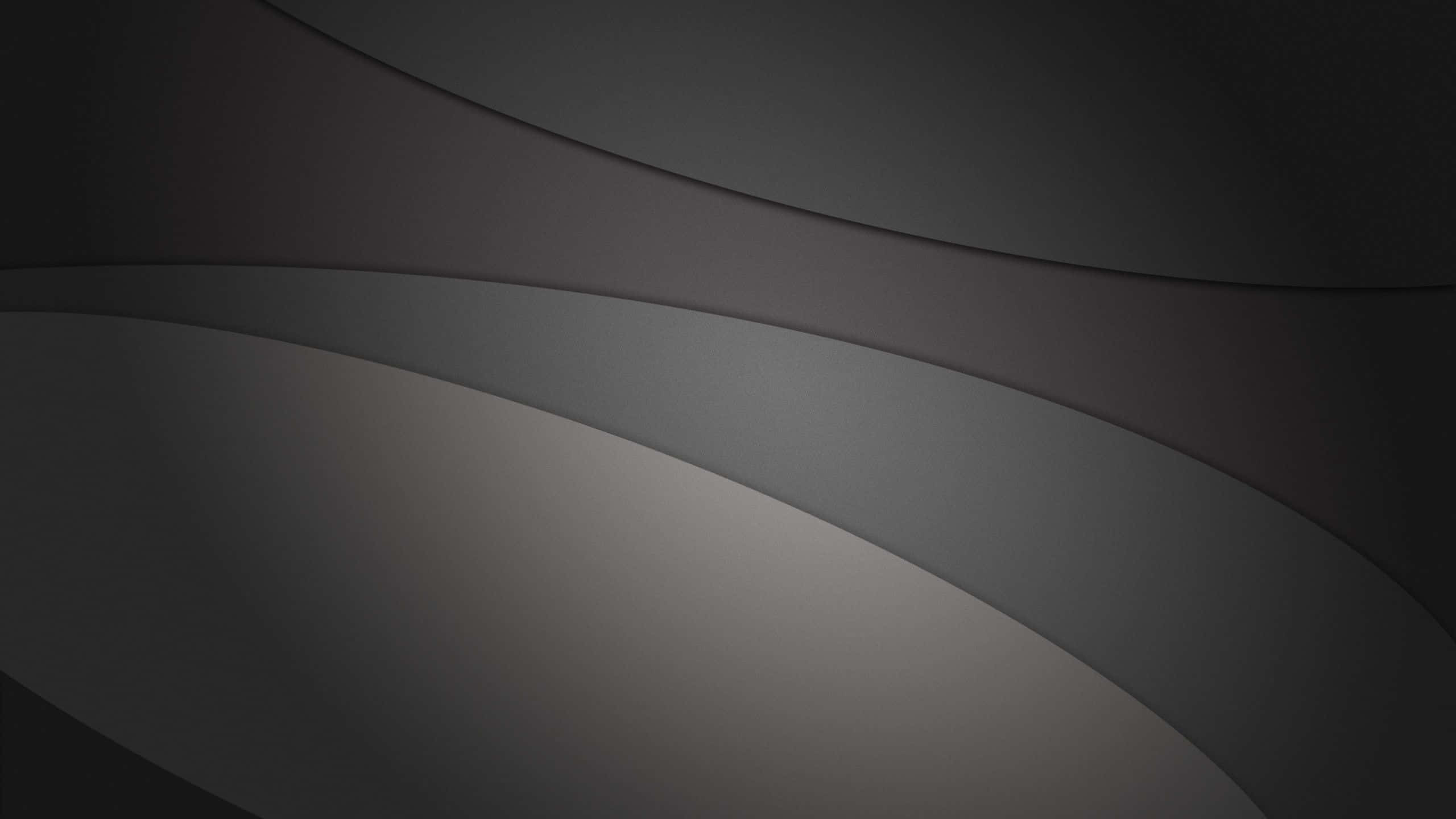 Dark Minimalist 桌布 壁紙 — 流暢的炭灰色和柔和銀色曲線營造出具有微妙深度的極簡抽象構圖。