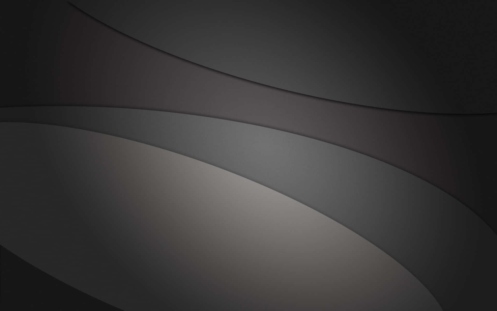 Grey Desktop 桌布 壁紙 — 流暢的炭灰色和柔和銀色曲線營造出具有微妙深度的極簡抽象構圖。