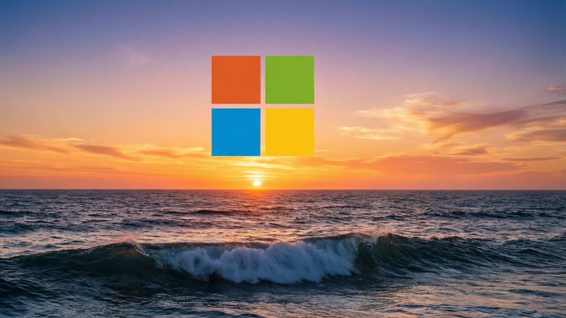 海洋日落微軟 壁紙 — Microsoft 標誌漂浮在橙、粉紅和藍色天空的海浪上充滿活力的日落之上。