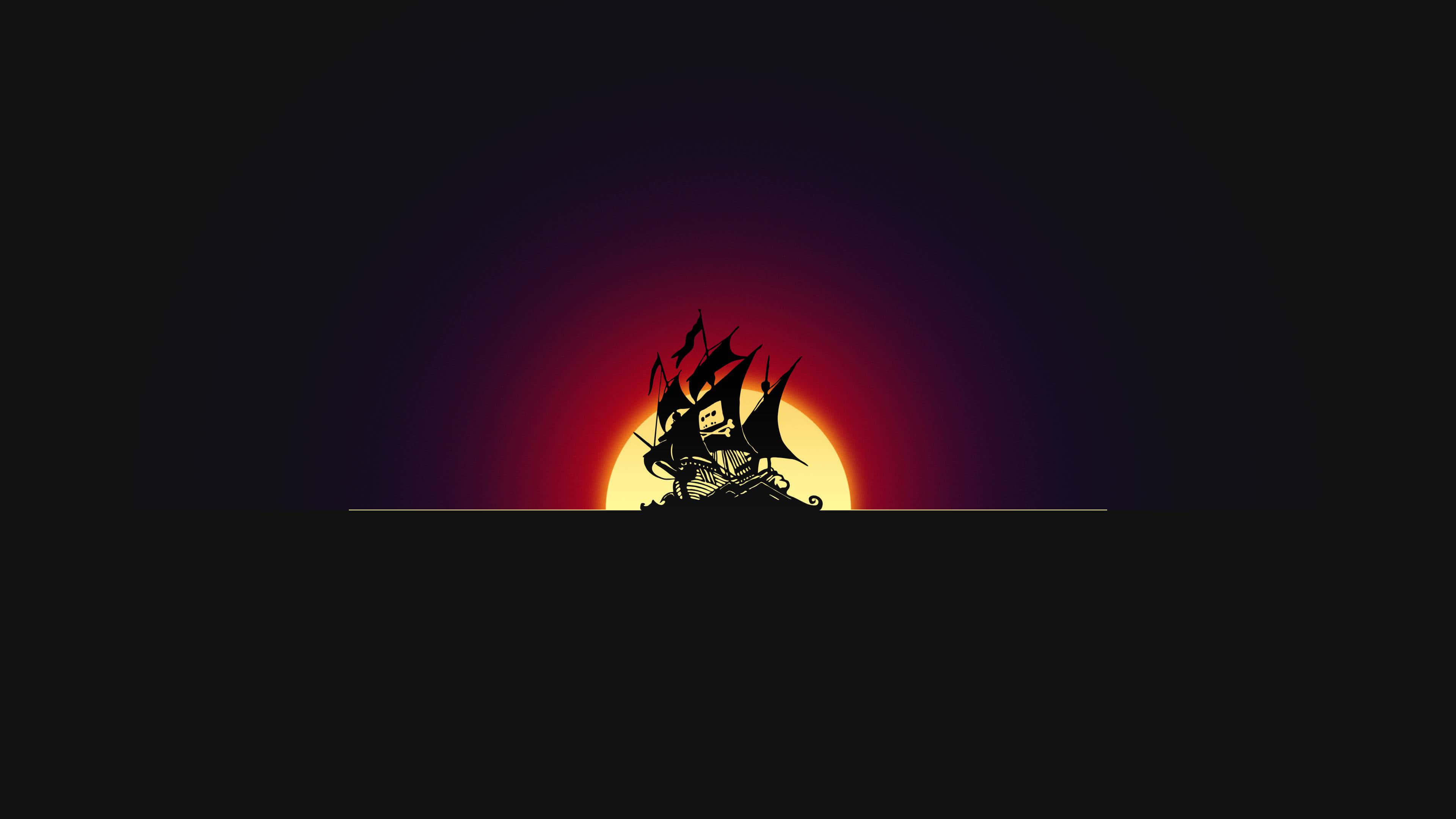 海盜 桌布 壁紙 — 海盜船剪影在燦爛的夕陽下航行，帶有鮮豔的紅色和紫色漸變。