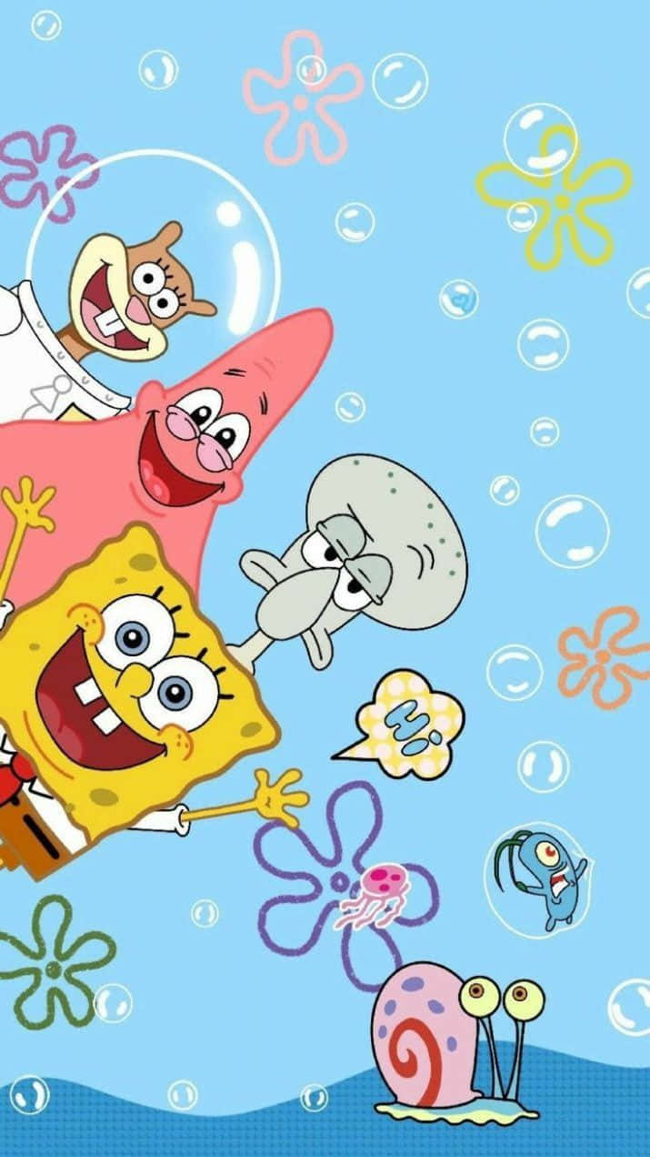 Cute Cartoon Characters 桌布 壁紙 — 海綿寶寶、派大星和章魚哥在明亮卡通場景中，與泡泡和色彩繽紛的海花一起快樂地漂浮在水下。