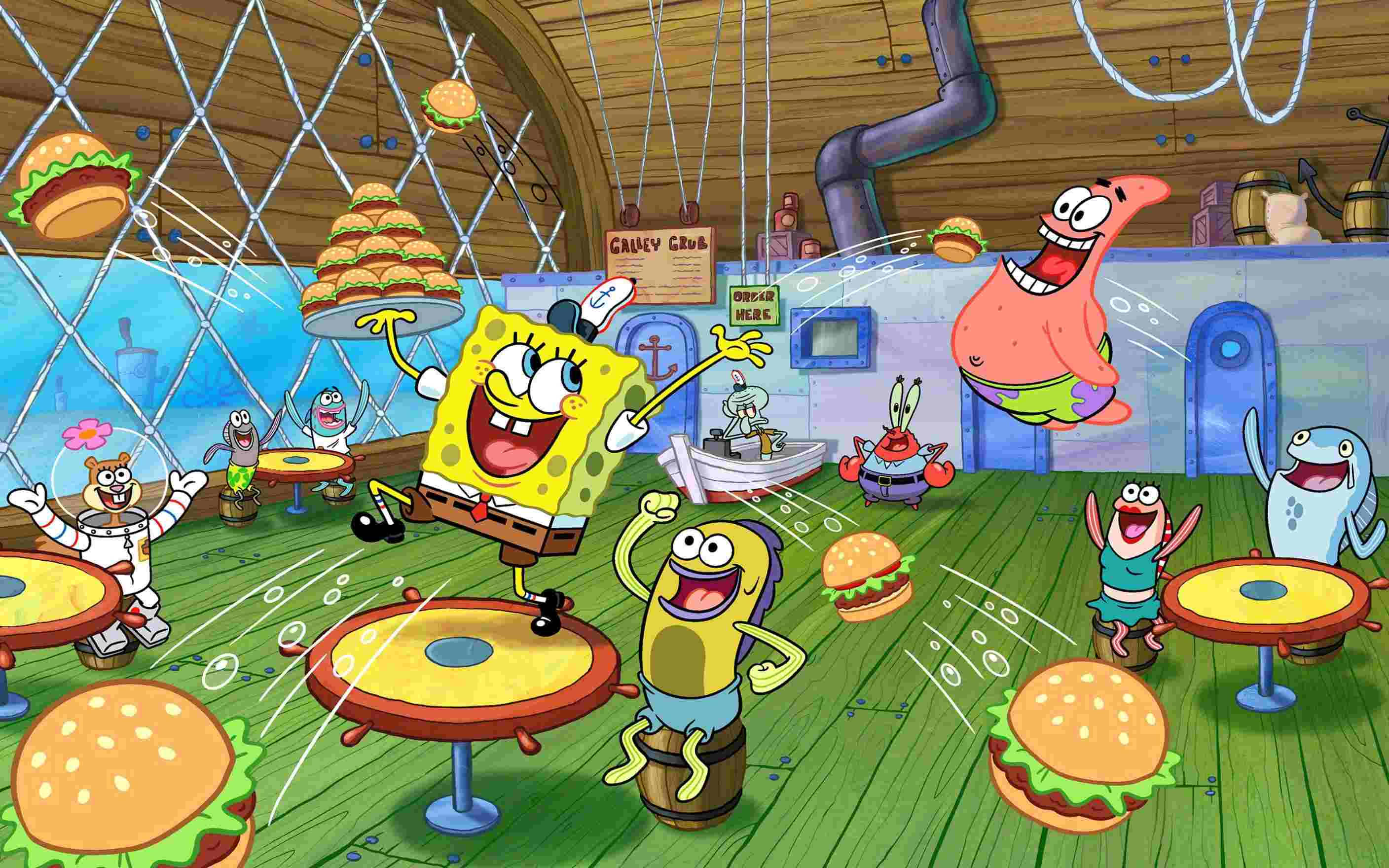 Funny Spongebob 桌布 壁紙 — 海綿寶寶和朋友們在一個混亂的漢堡主題水下餐廳裡快樂地跳舞，餐廳裡充滿了飛舞的漢堡和歡呼的顧客。