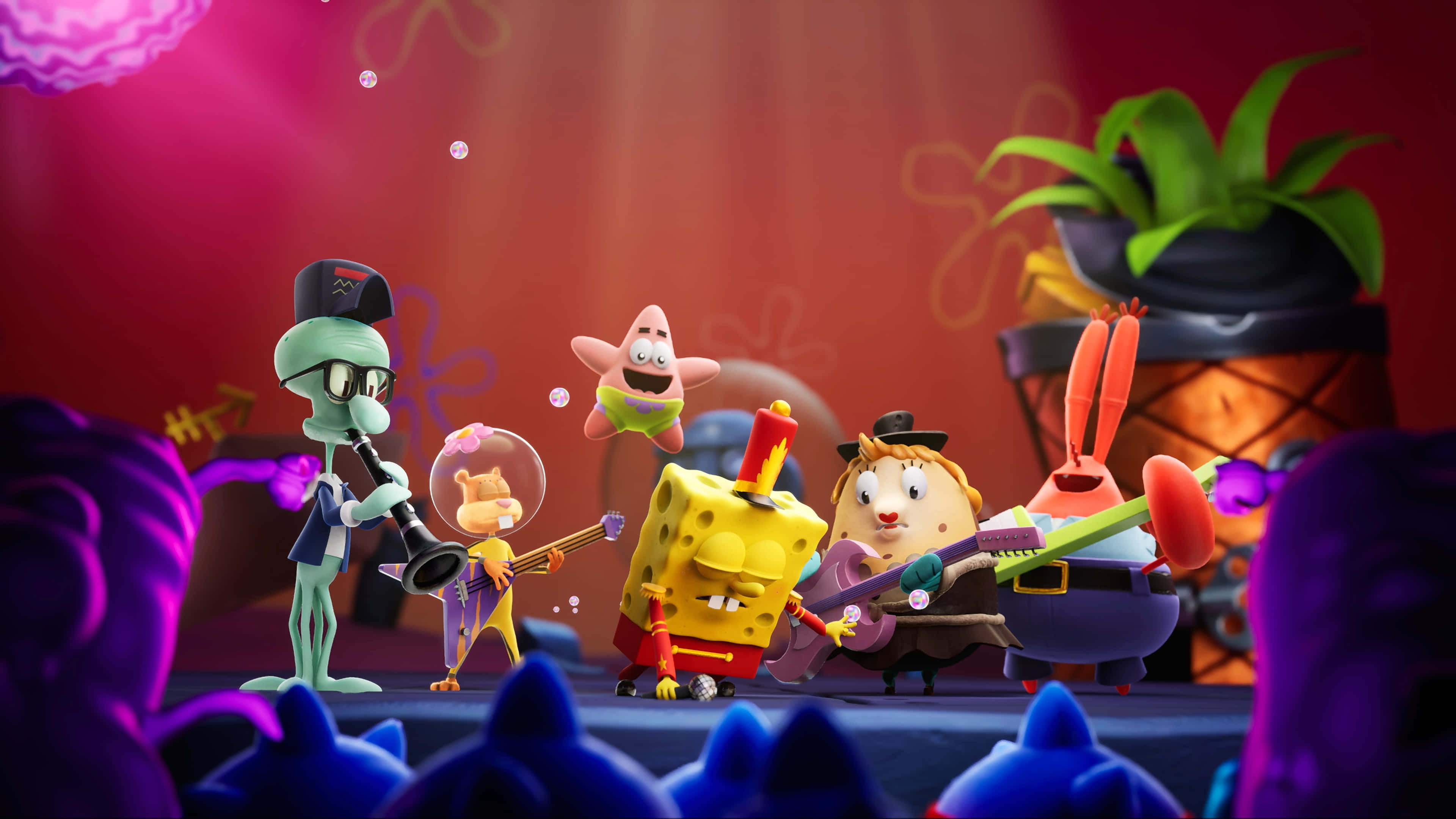 Spongebob Desktop 桌布 壁紙 — 海綿寶寶和朋友們在舞台上進行一場熱鬧的音樂會，舞台下是鮮豔的粉紅色和紫色燈光，前景是動畫人群。