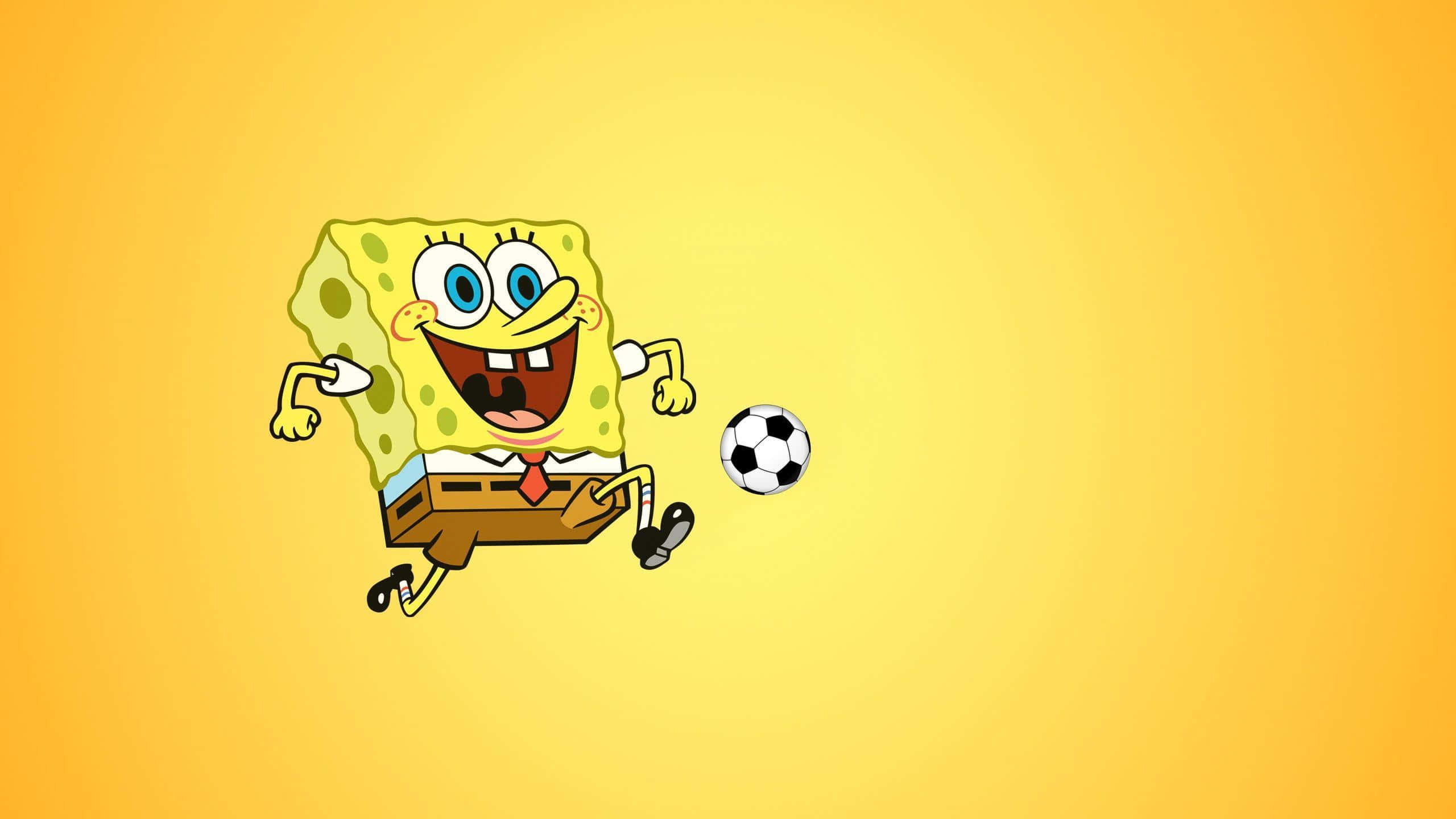 Spongebob Desktop 桌布 壁紙 — 海綿寶寶在明亮的黃色漸層背景上愉快地踢足球。