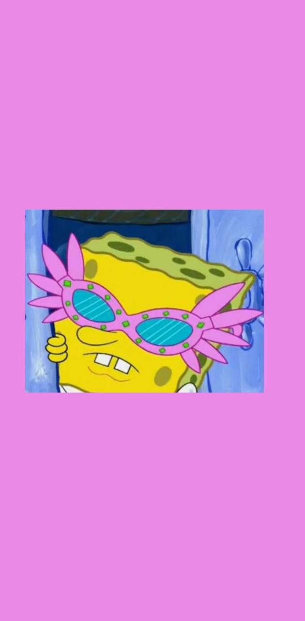 Funny Spongebob 桌布 壁紙 — 海綿寶寶戴著超大粉紅色星爆框太陽眼鏡，背景為純粉紅色。
