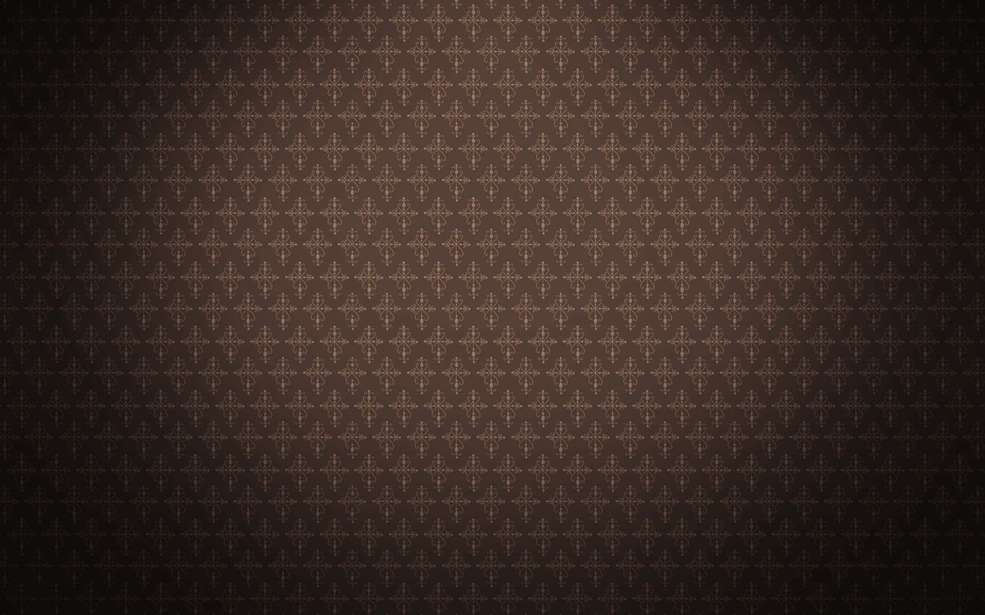 Brown Vintage 桌布 壁紙 — 深棕色壁紙，帶有重複的金色十字形圖案，逐漸淡入陰影邊緣。
